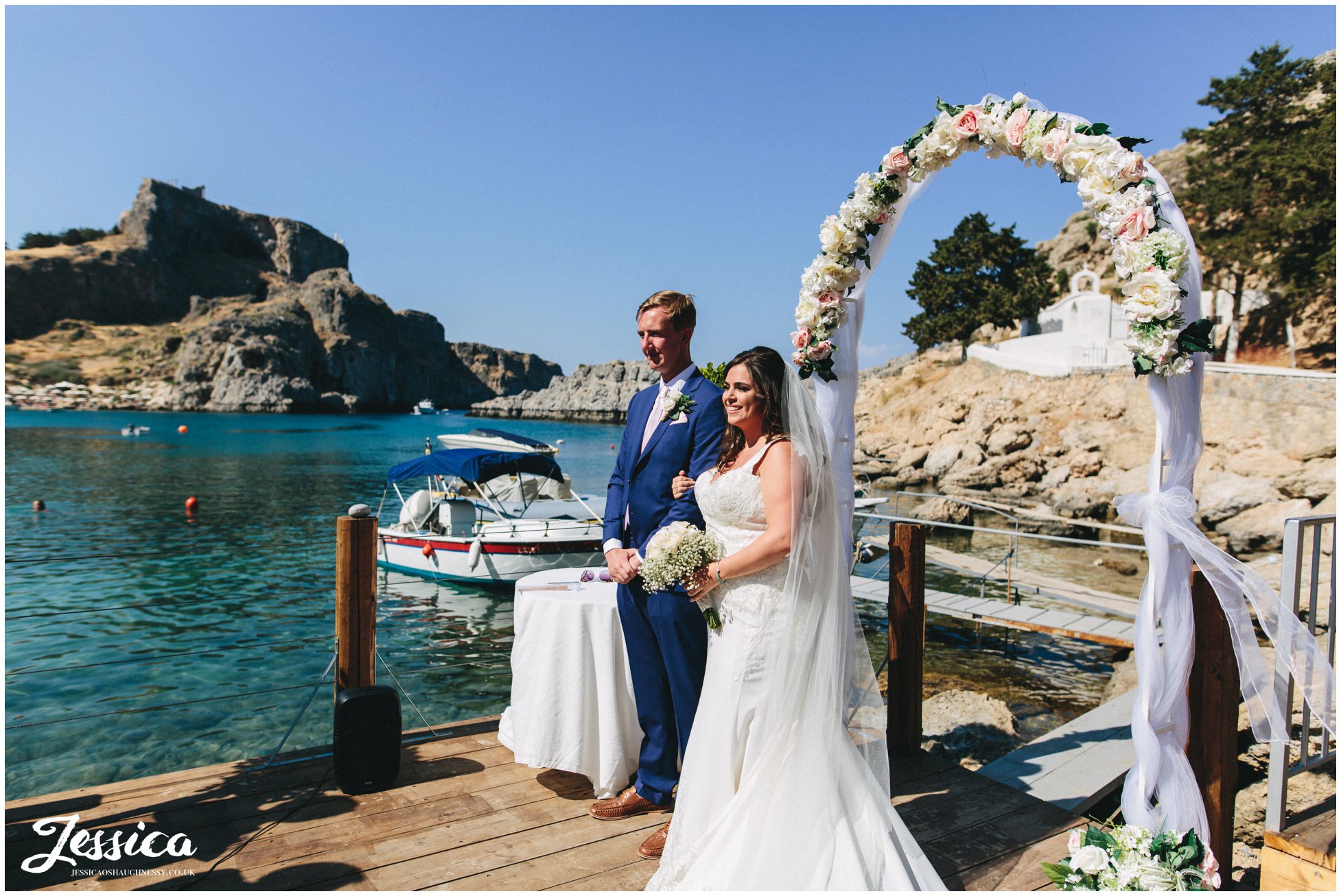 bride & groom hold hands during their wedding ceremony
