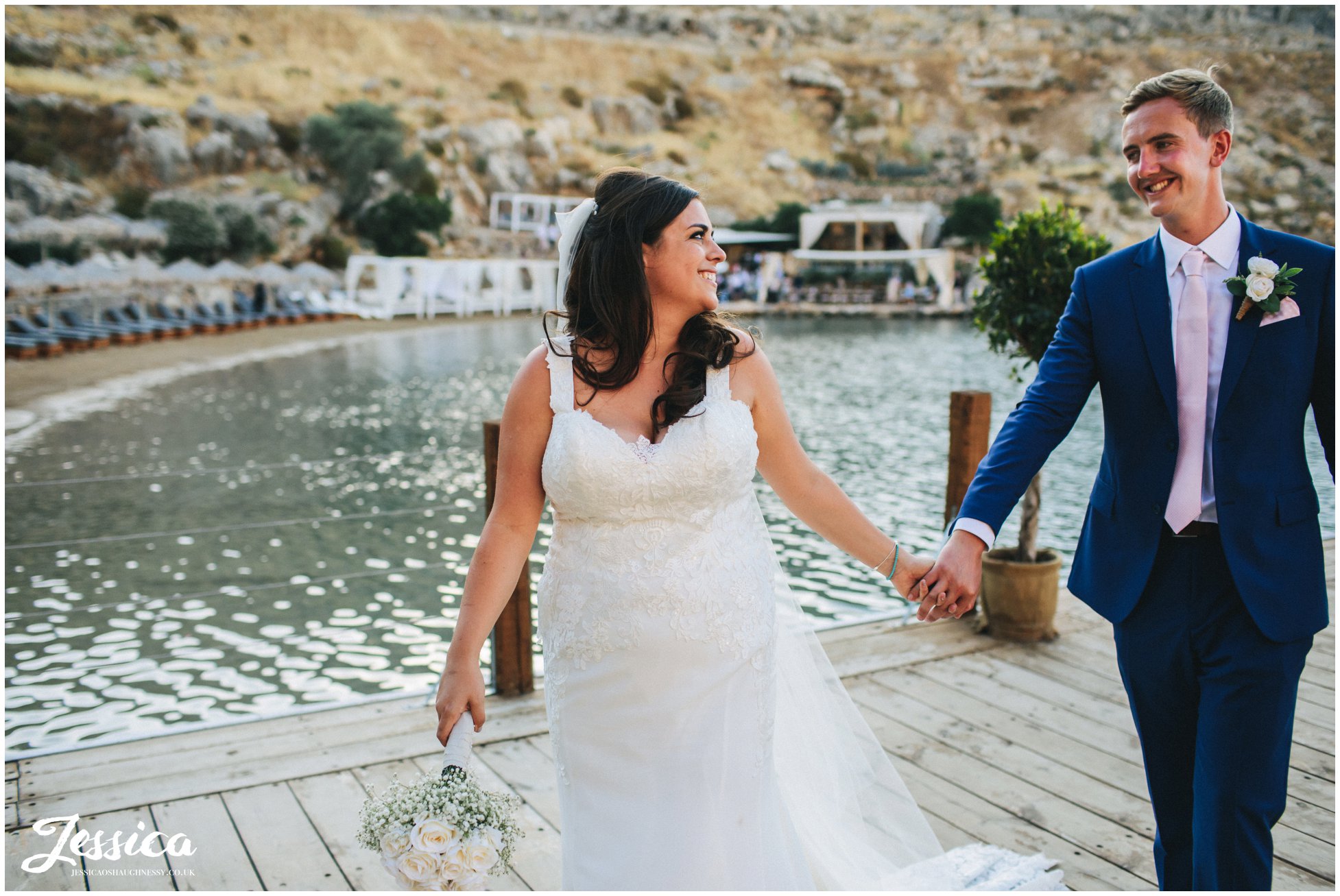 bride leads the groom back to their wedding reception at Tambakio Restaurant