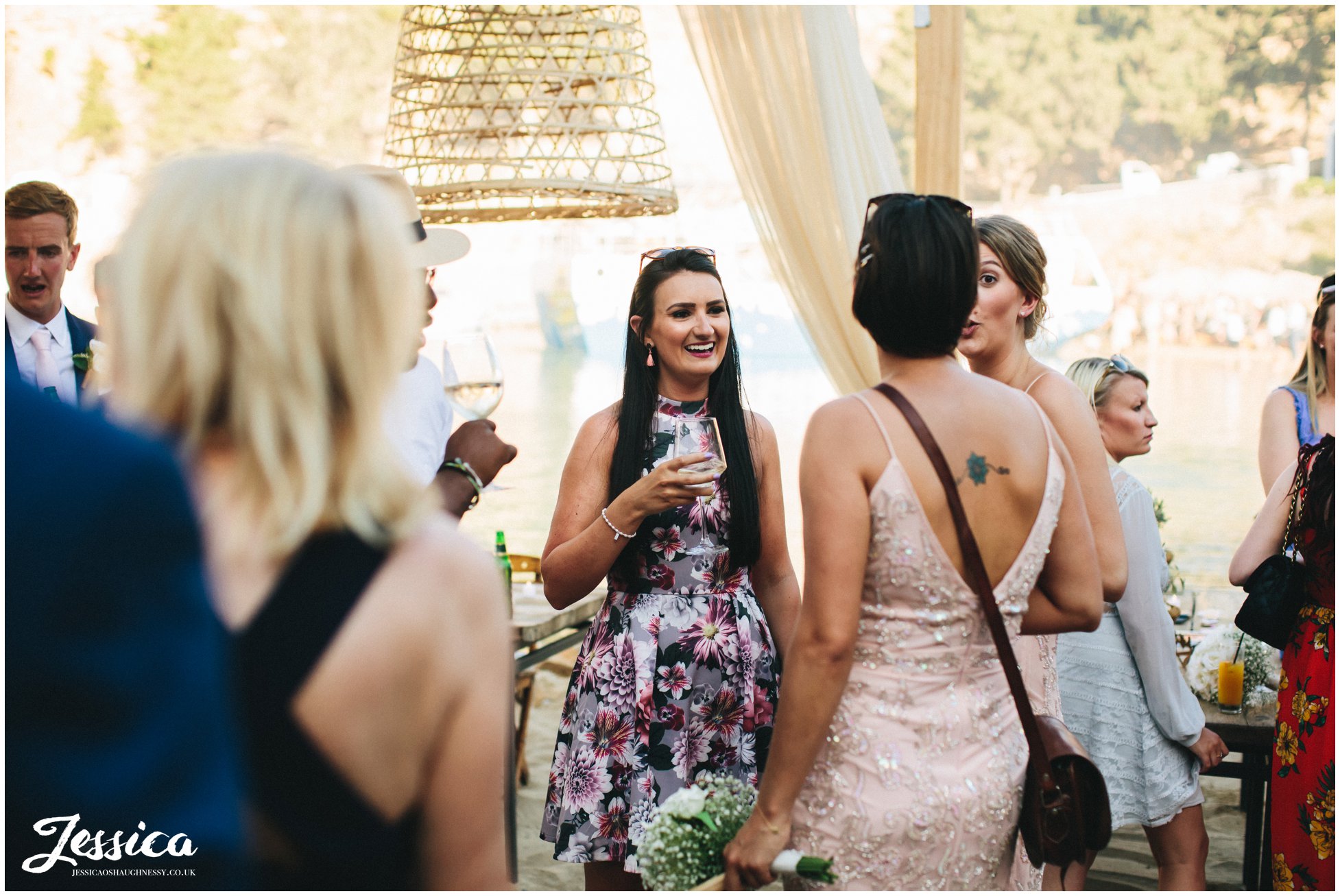 wedding guests enjoy welcome drinks at Tambakio Restaurant in rhodes