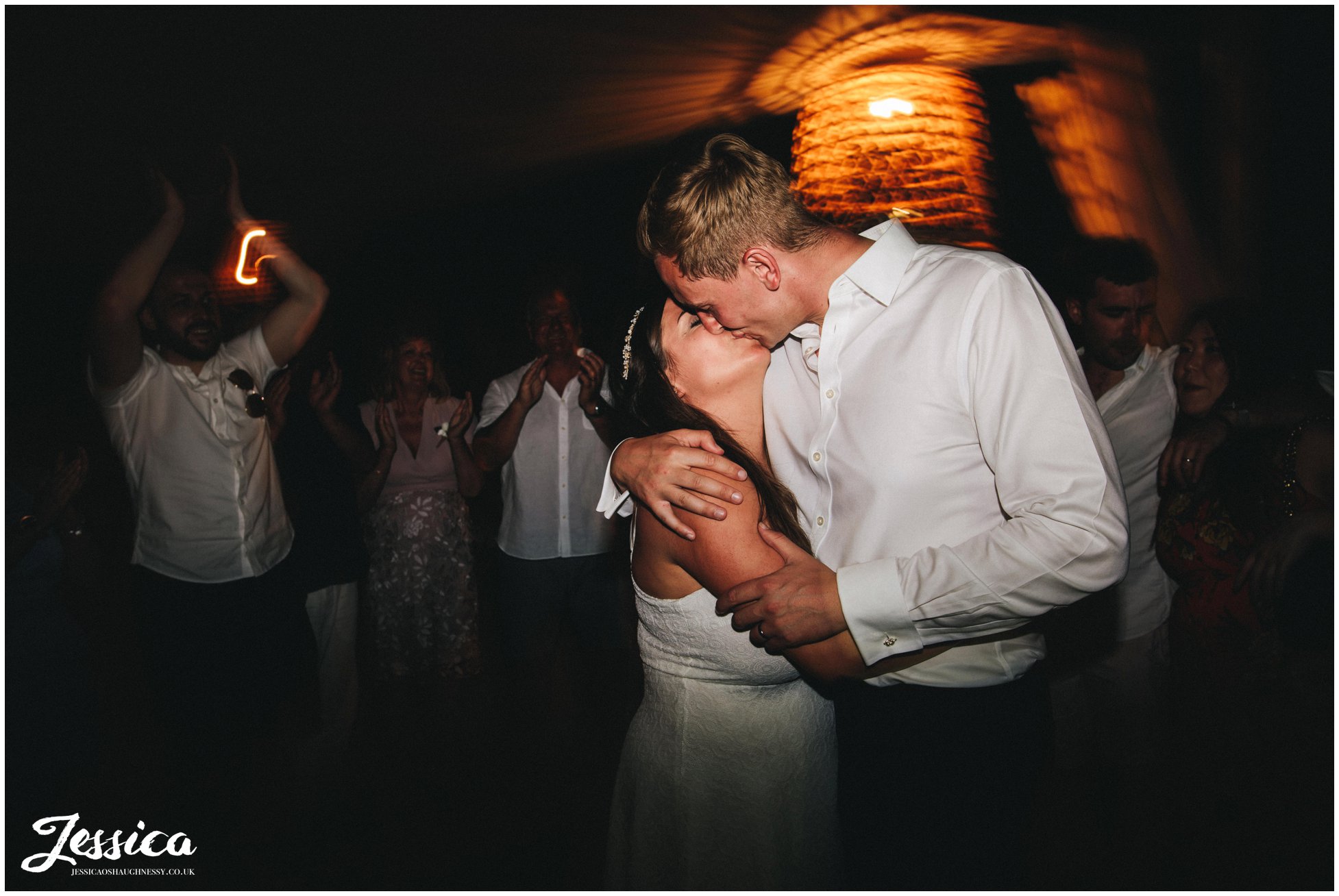 newly wed's kiss on the dancefloor at their st paul's bay wedding in greece