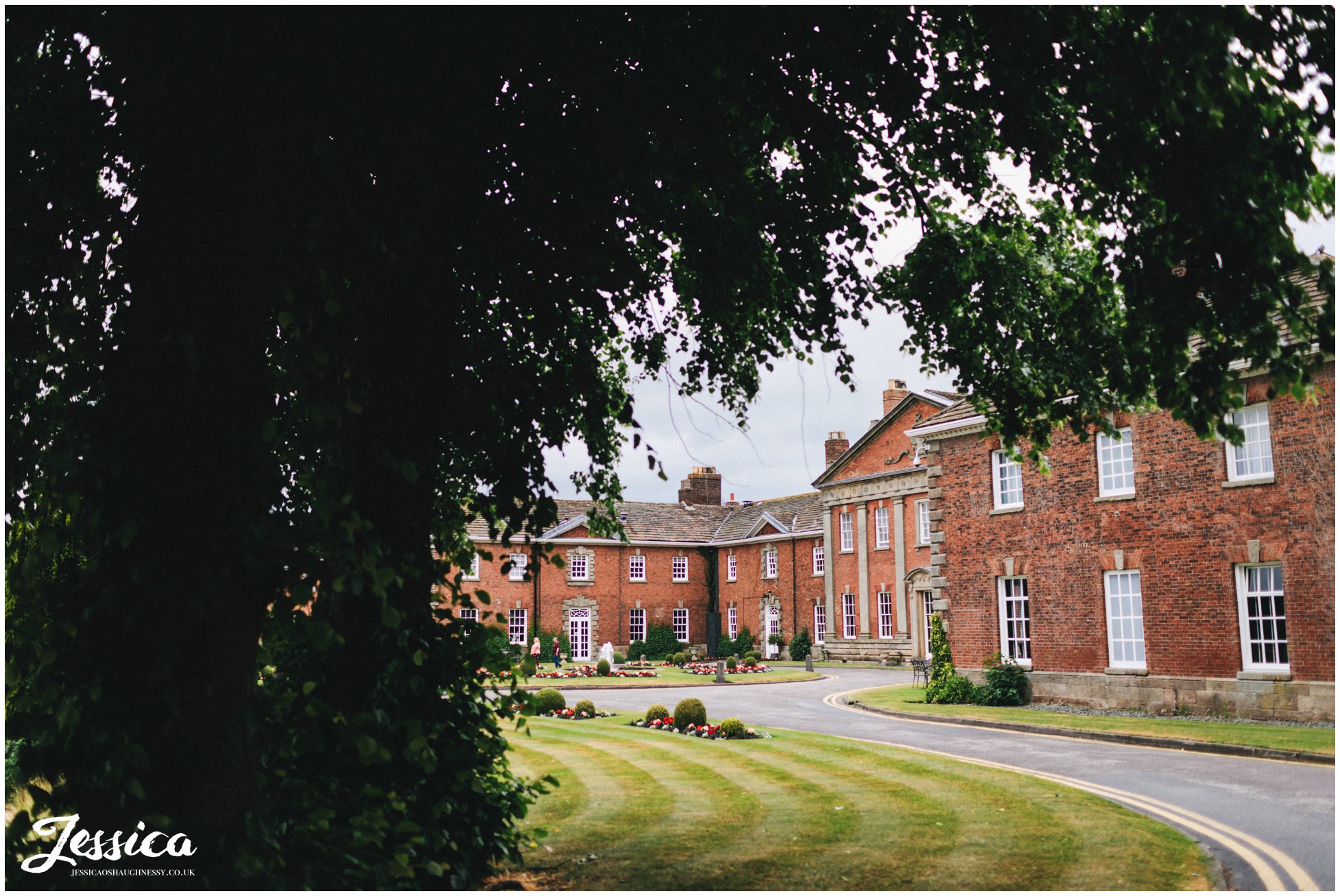 photograph of Mottram Hall through the trees