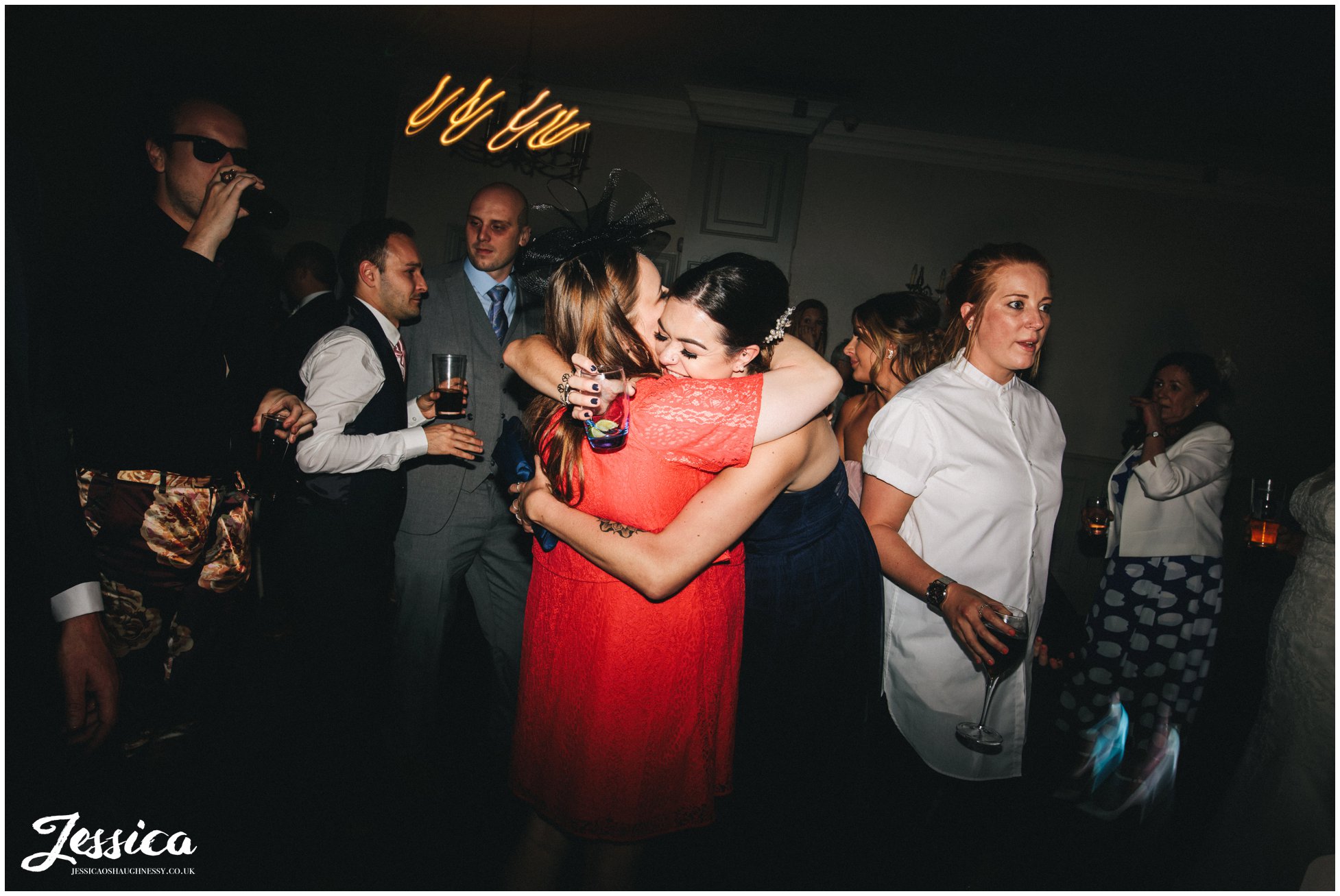 guests hug on the dancefloor at a cheshire wedding