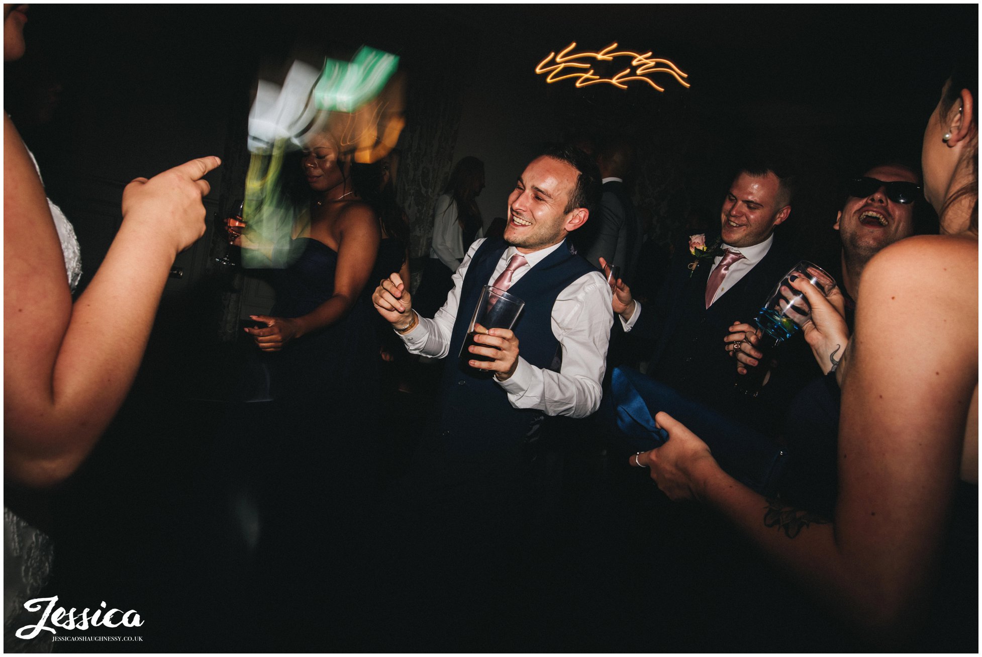 bridesmen dance at the wedding reception 