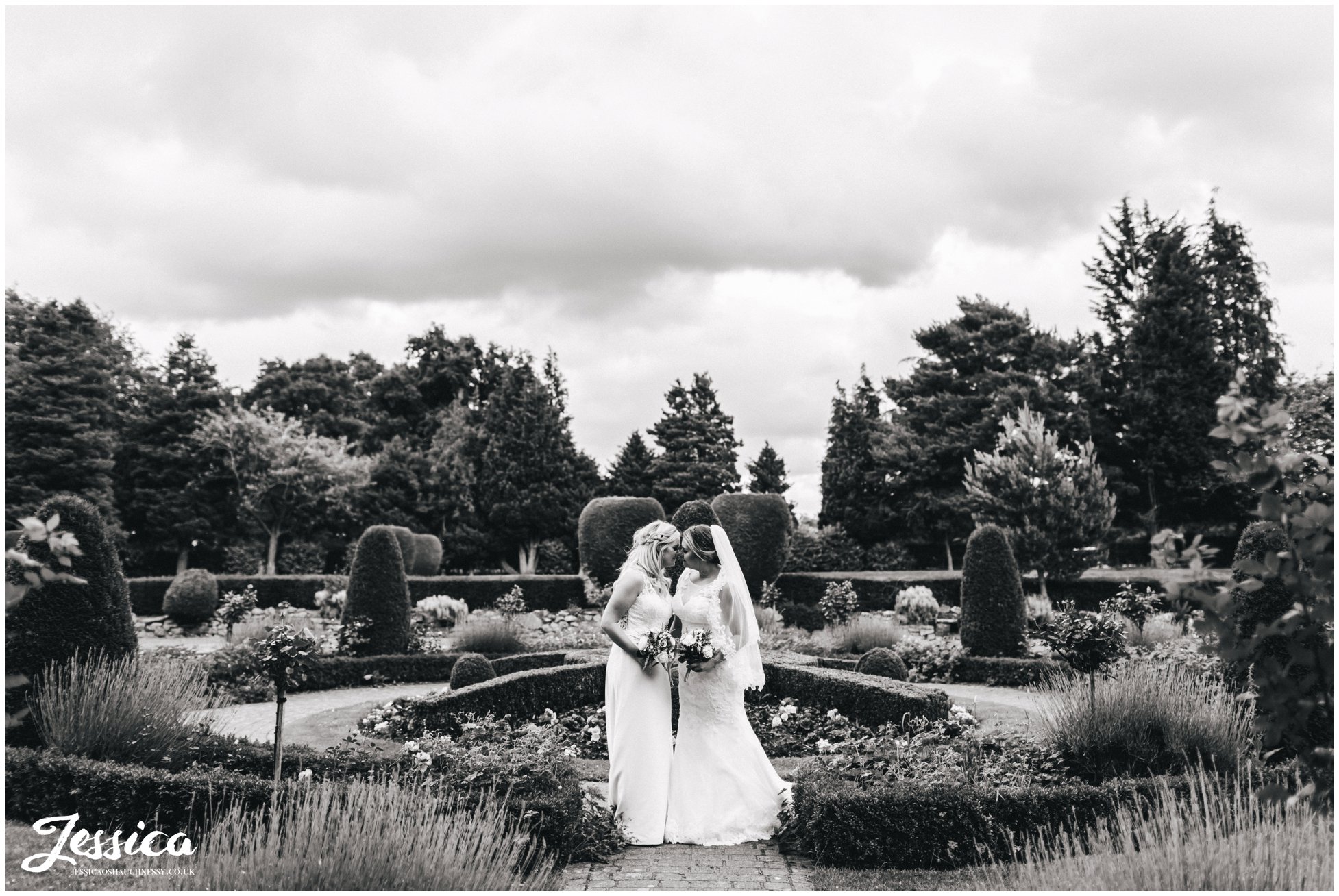 The bride's kiss in Mottram Halls gardens