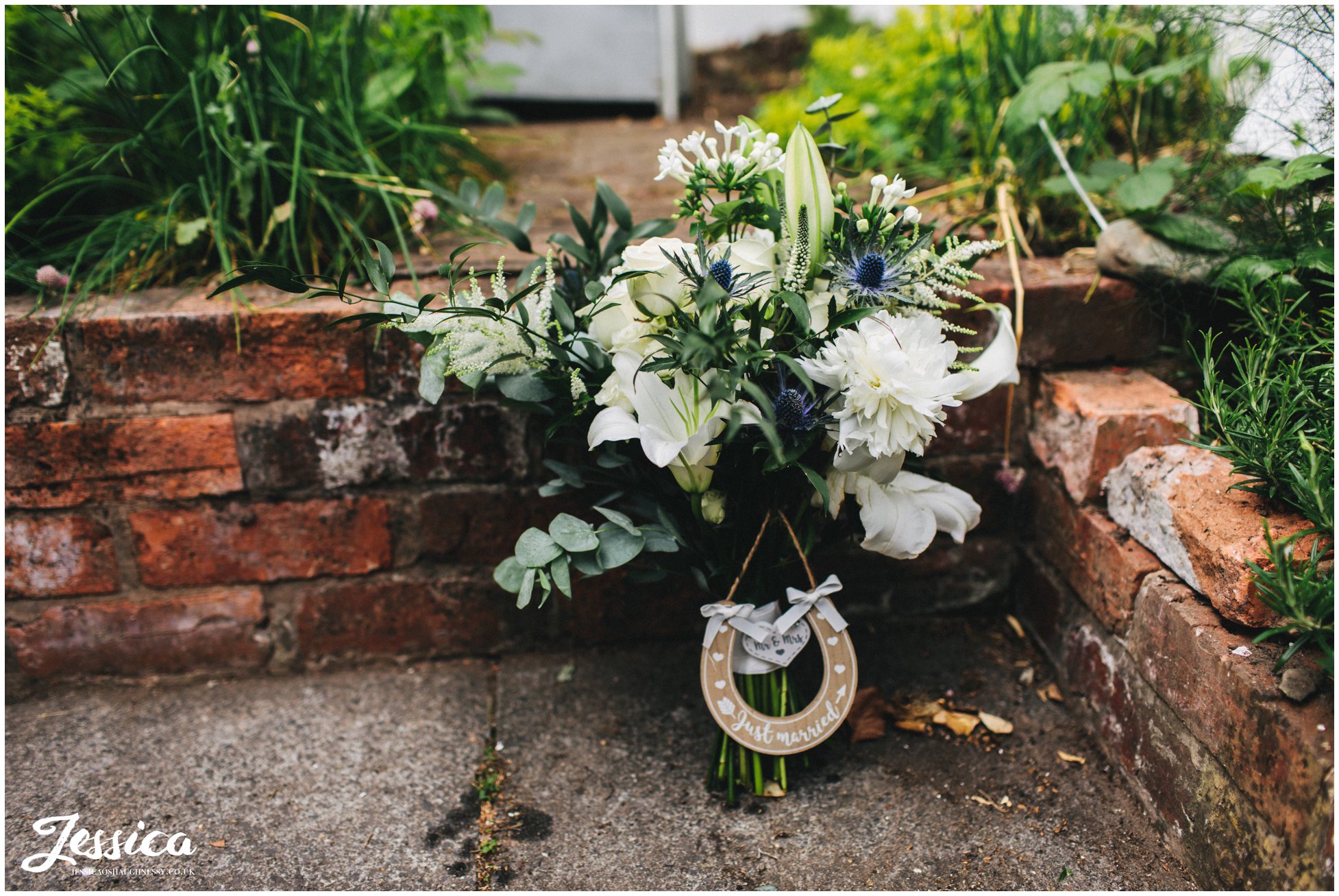 the brides bouquet sits with a lucky horseshoe attached