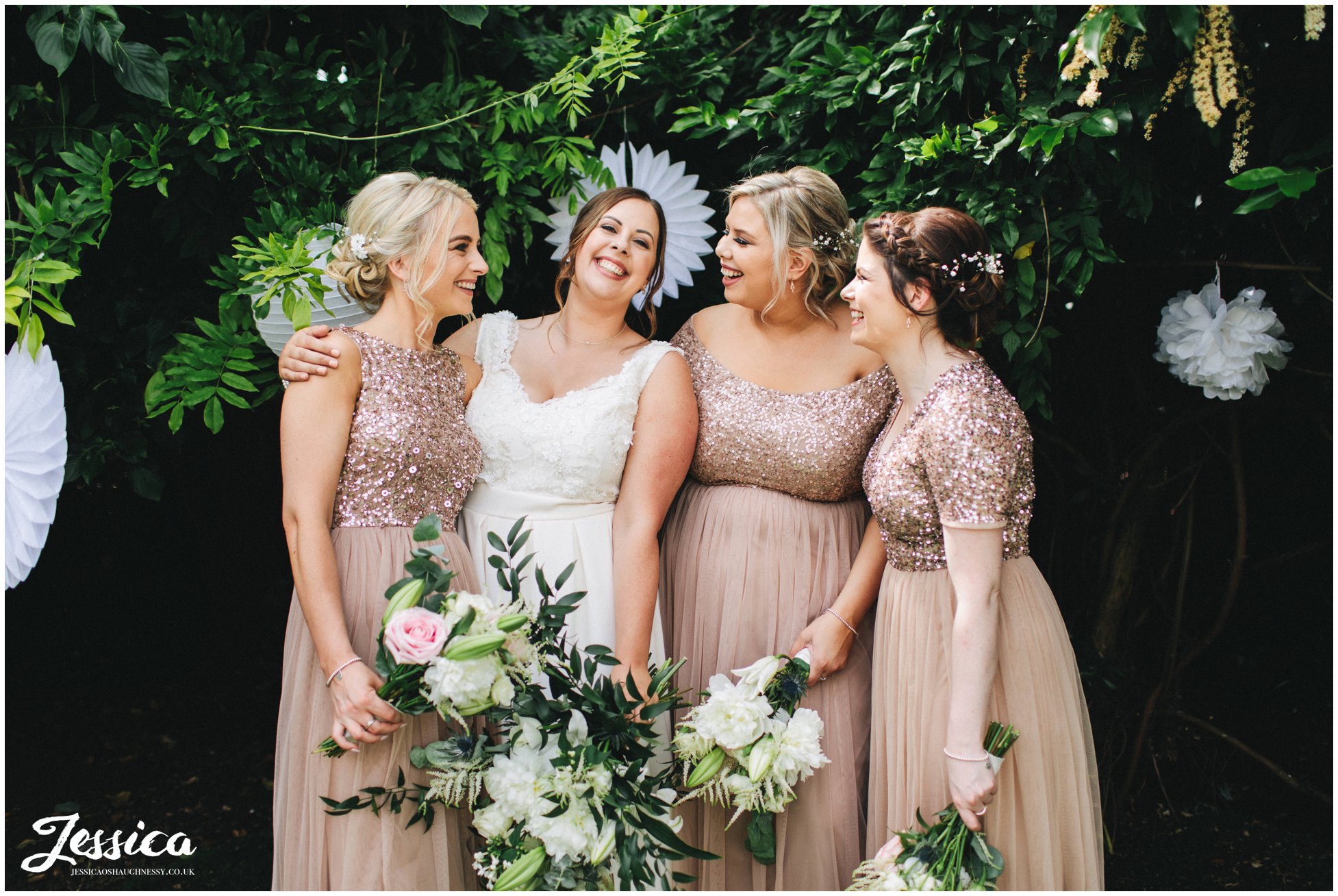 the bride laughs with her bridesmaids at belle epoque in cheshire