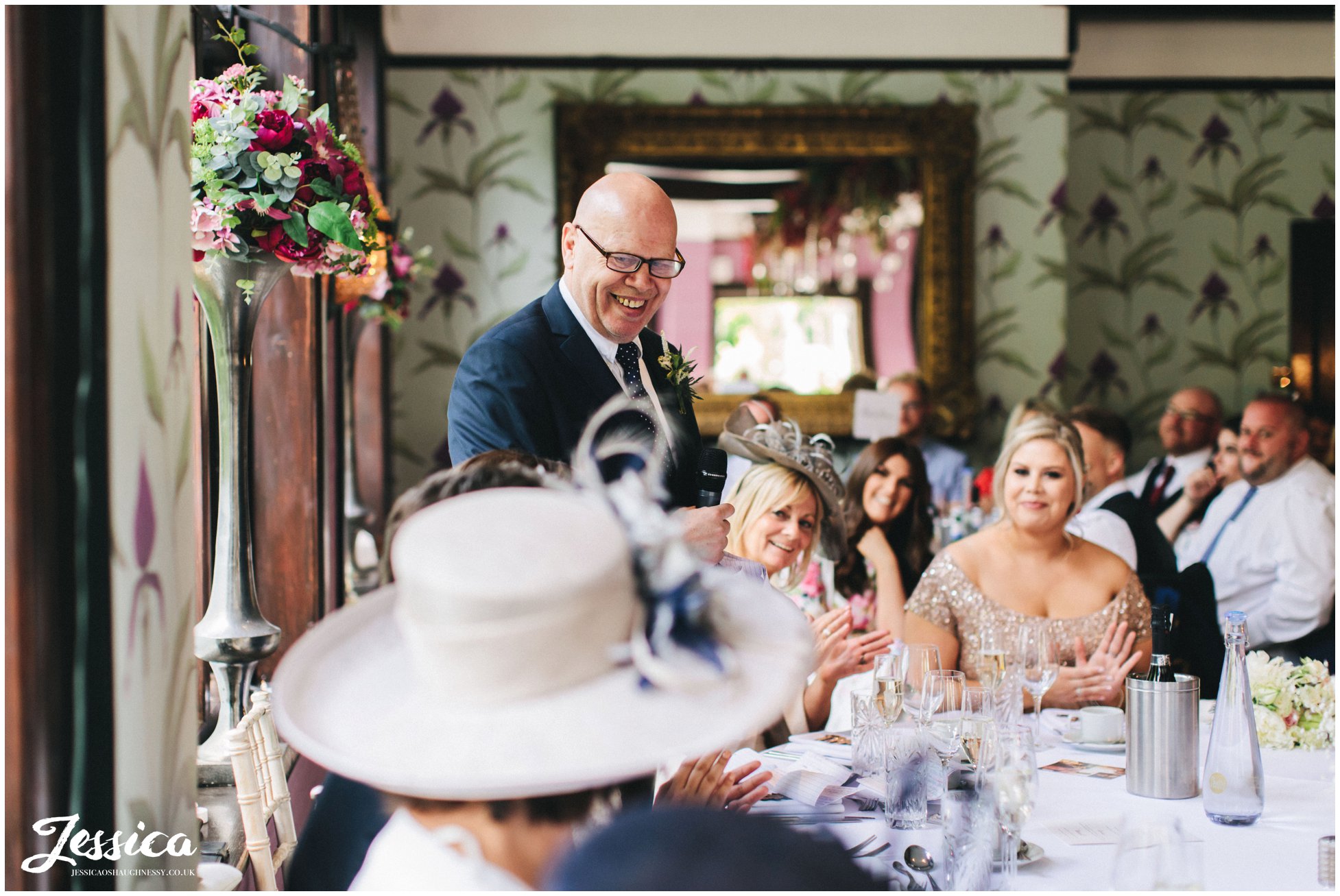 father of the bride laughs whilst giving his speech