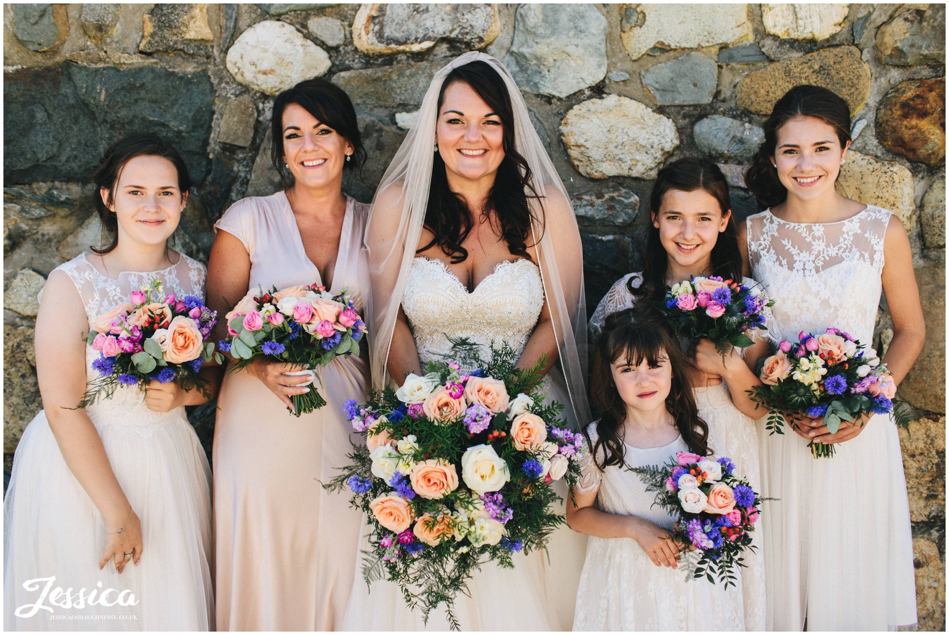 bride poses with her bridesmaids at her bach wen wedding