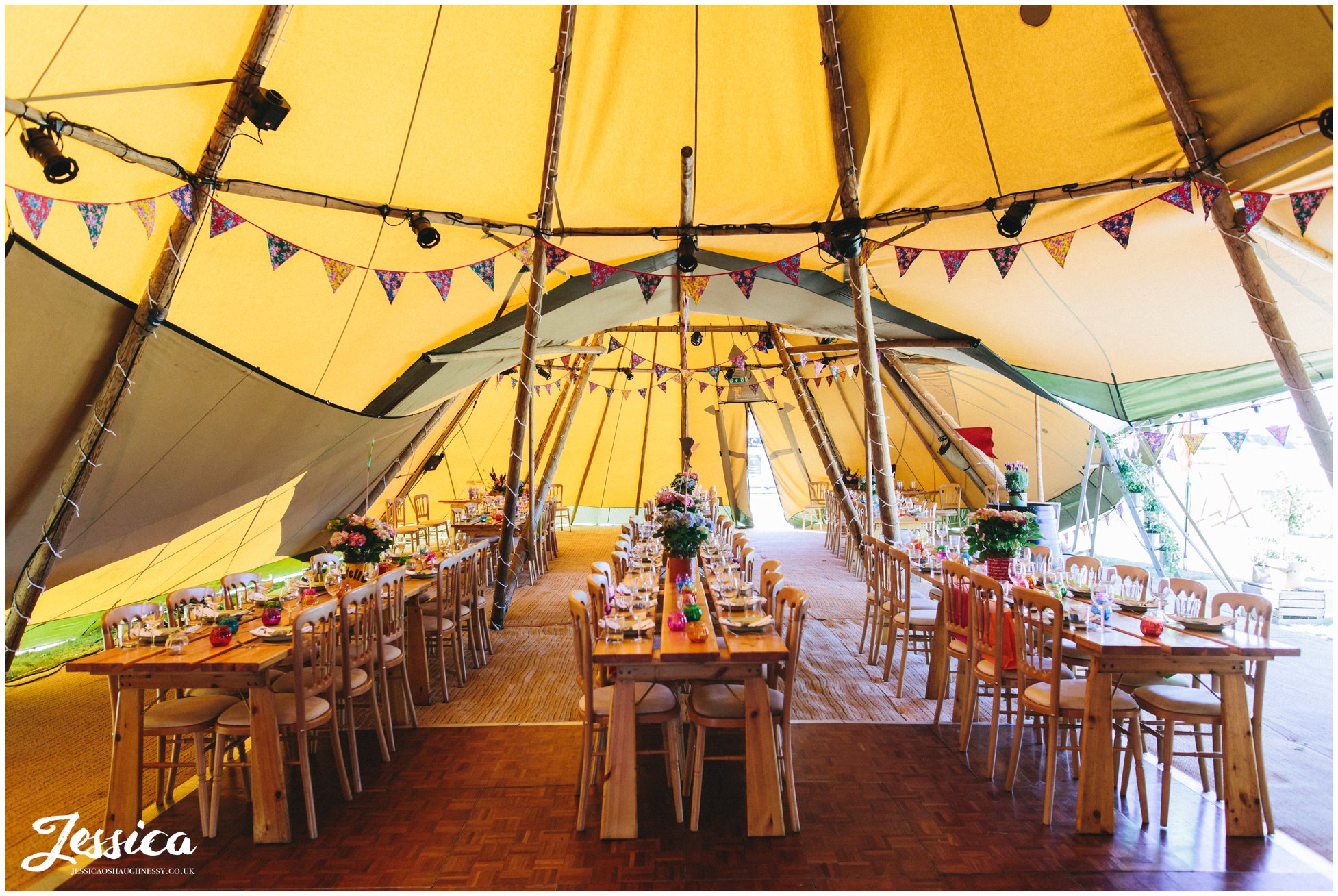 the tipi is decorated in bright colours for the wedding breakfast