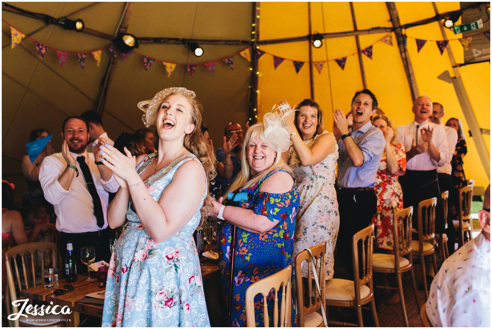 guest applaud the new couple as they enter the tipi at bach wen farm