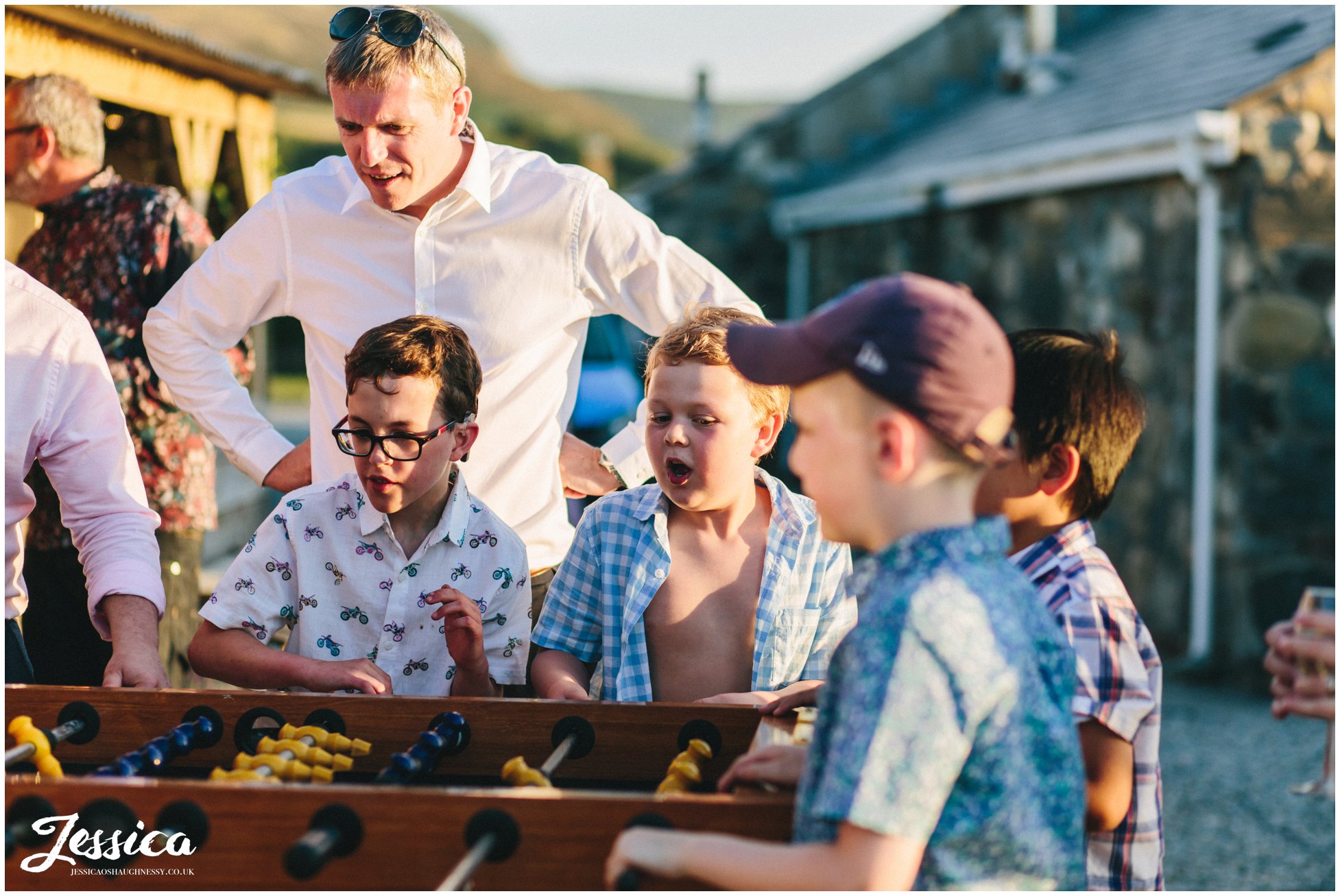 guests cheer as they play table football at bach wen farm in Caernarfon