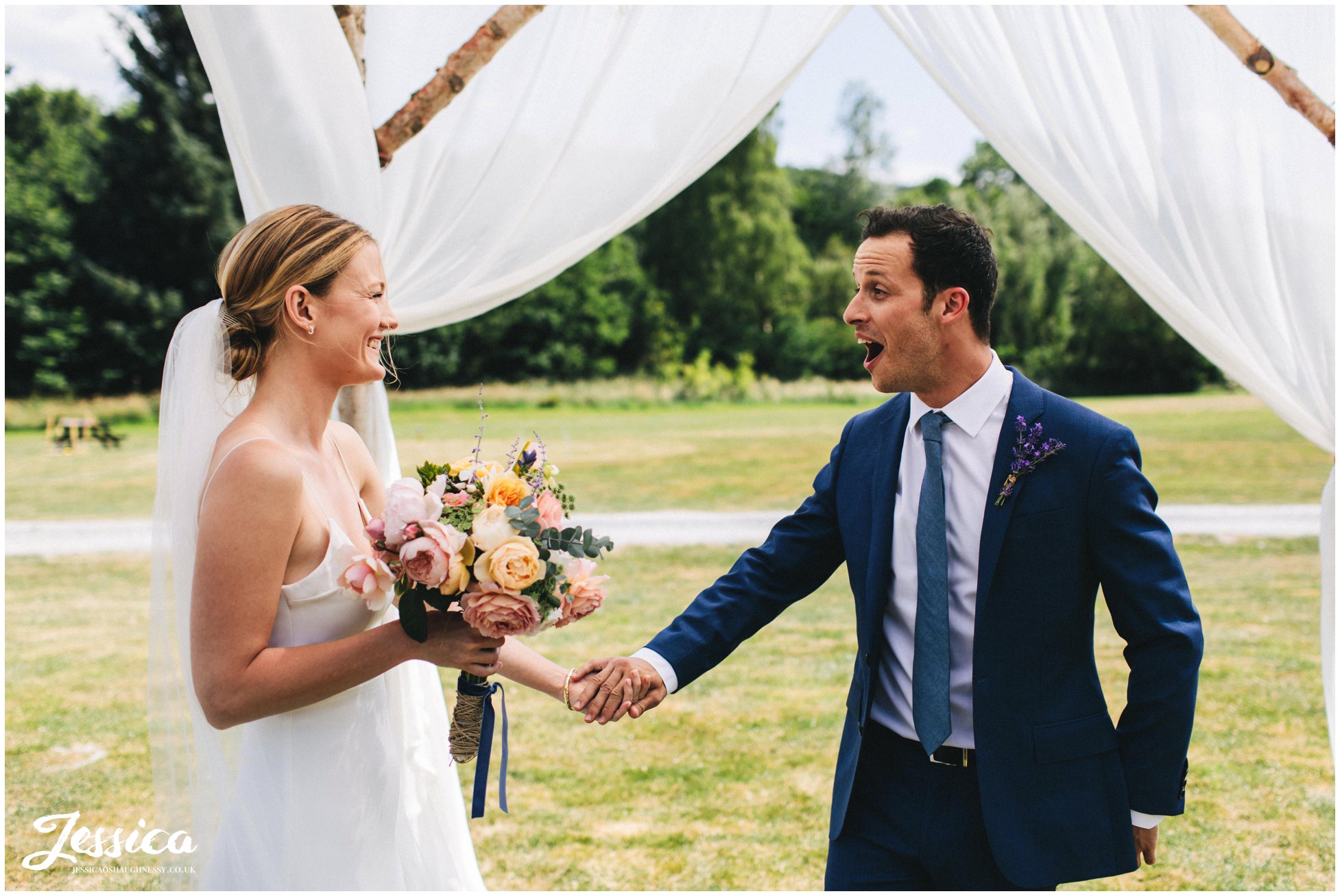 the groom see's his bride for the first time during their first look