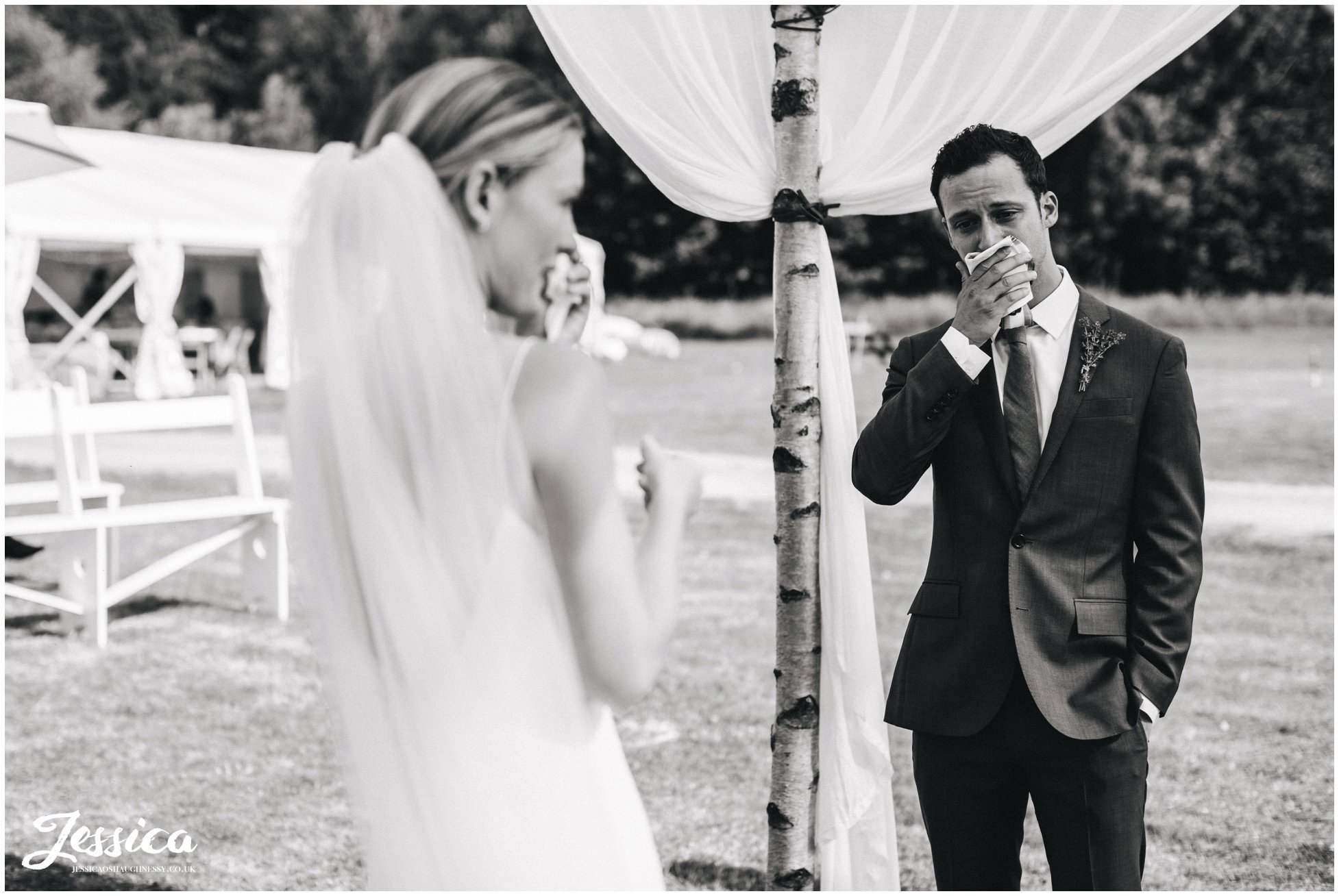 the couple wipe away tears during the emotional north wales wedding ceremony