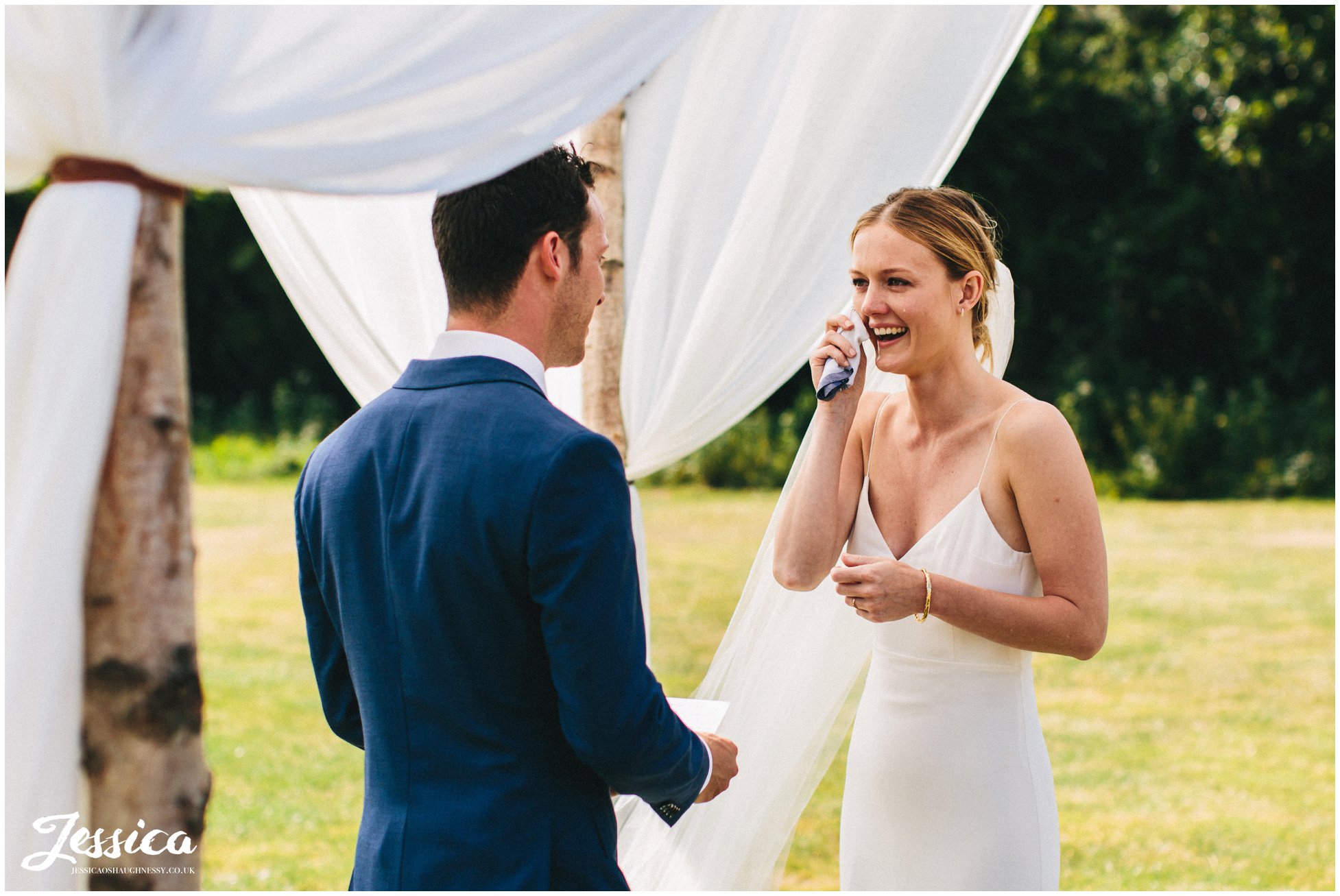 bride shed's a tear during the vow exchange