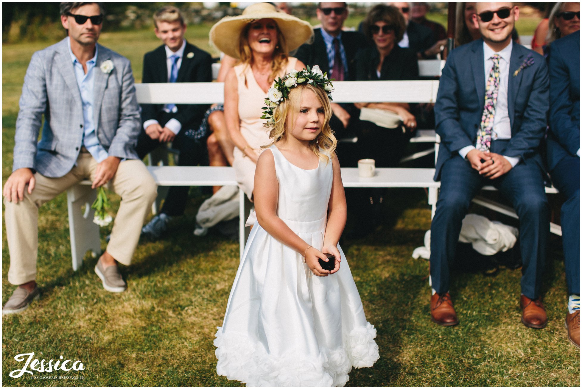 flower girl stands to give the rings