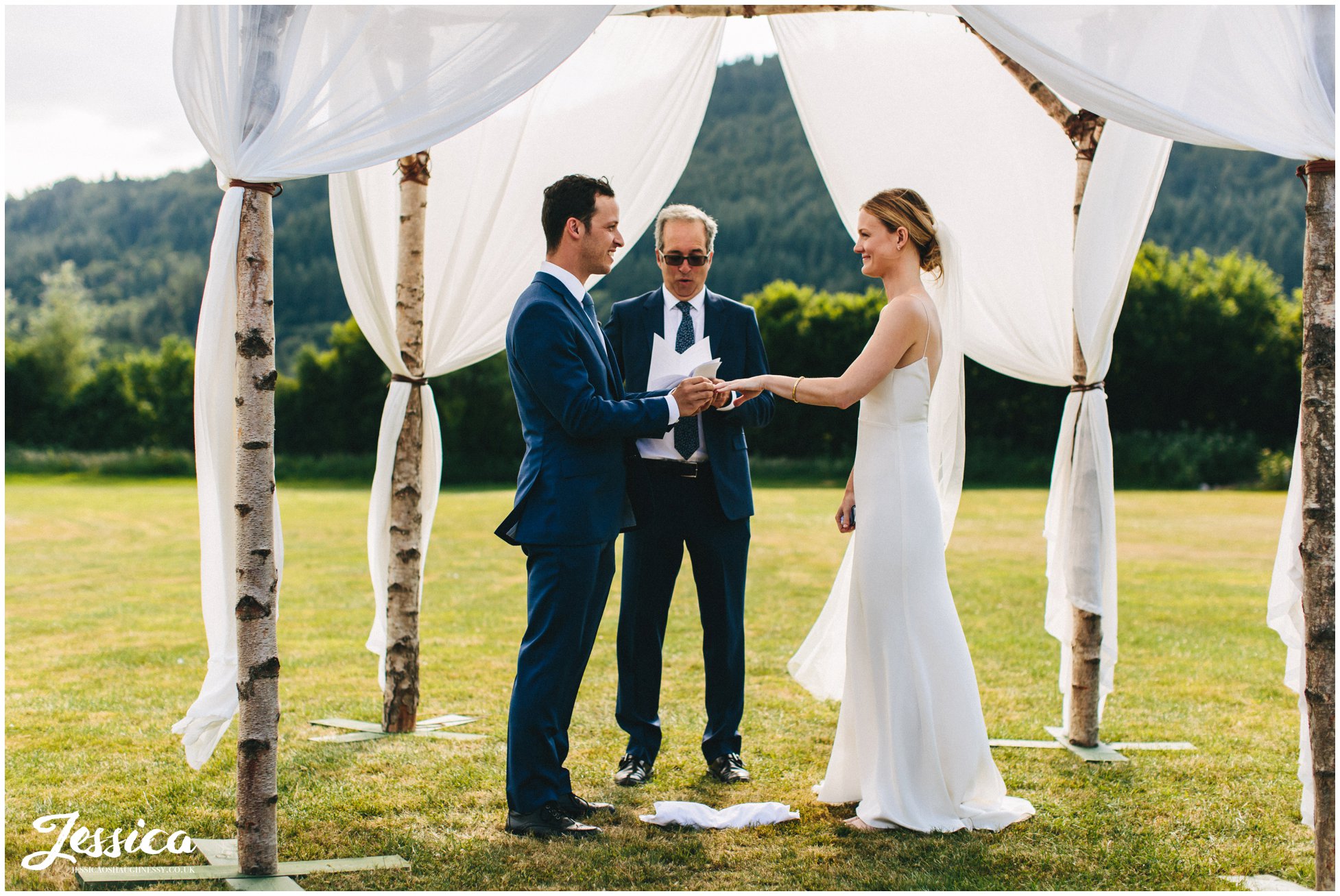 groom gives his bride her wedding ring at hafod farm, north wales