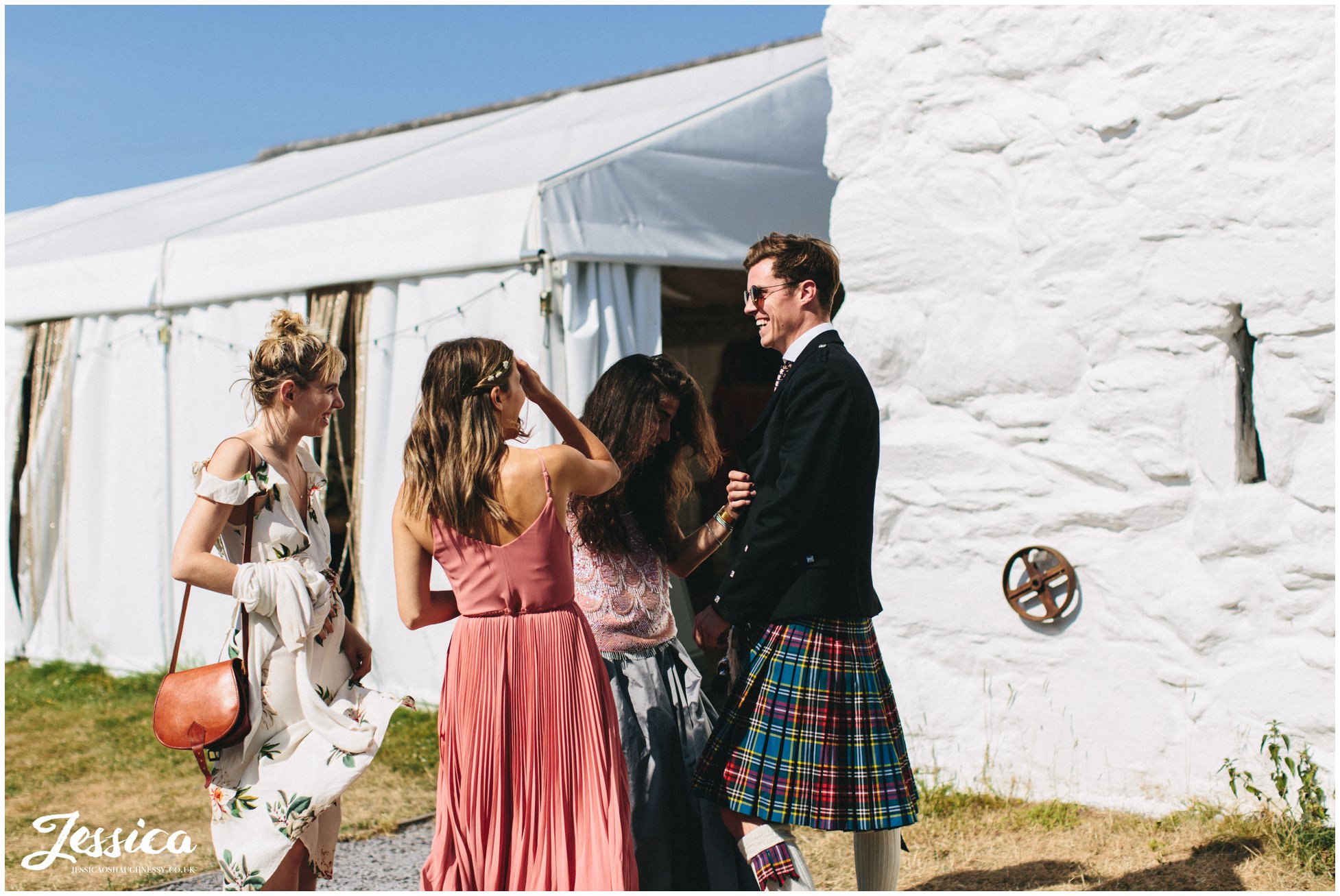 scottish guests wear kilts to the wedding