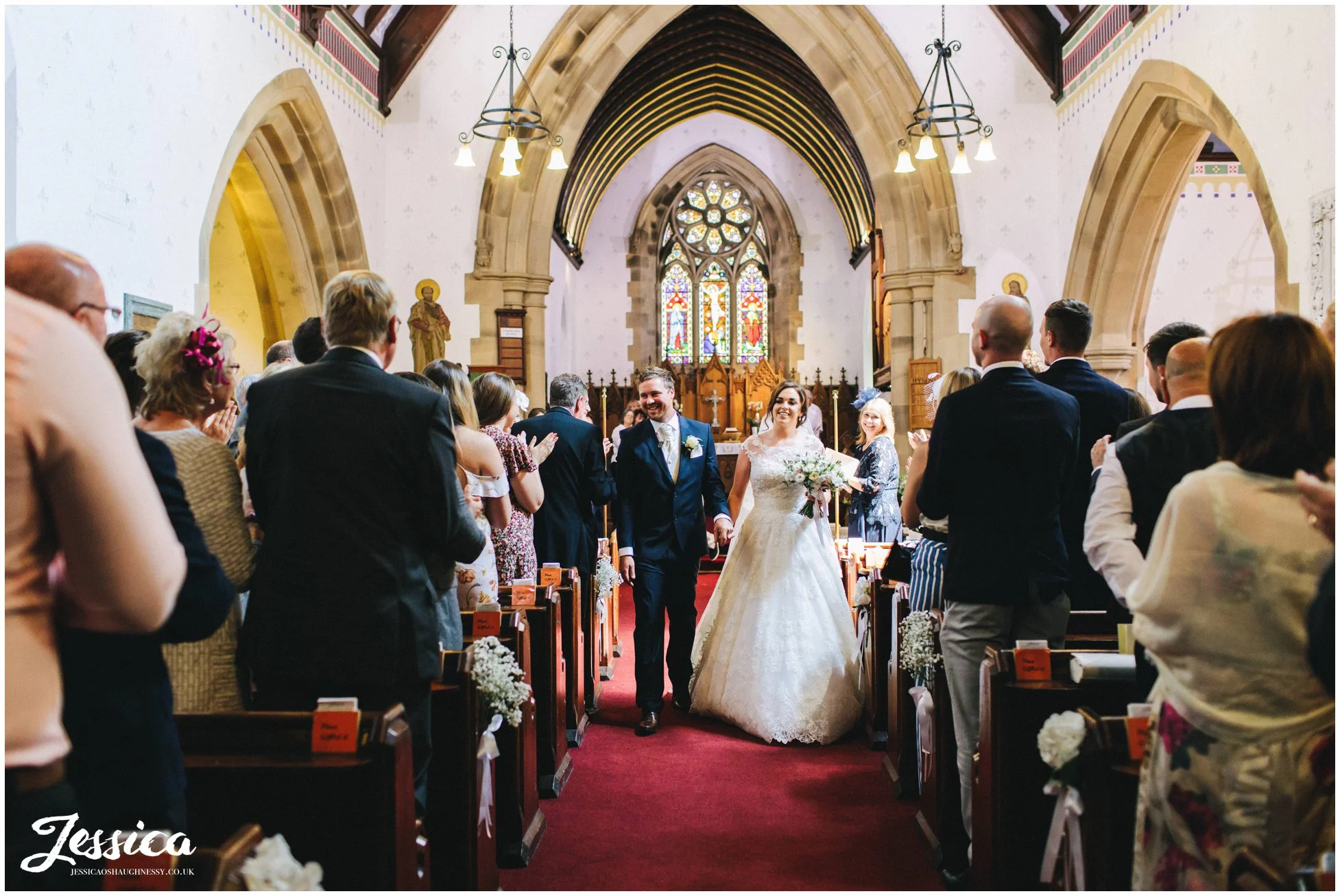 Bride & Groom walk down the aisle as husband and wife
