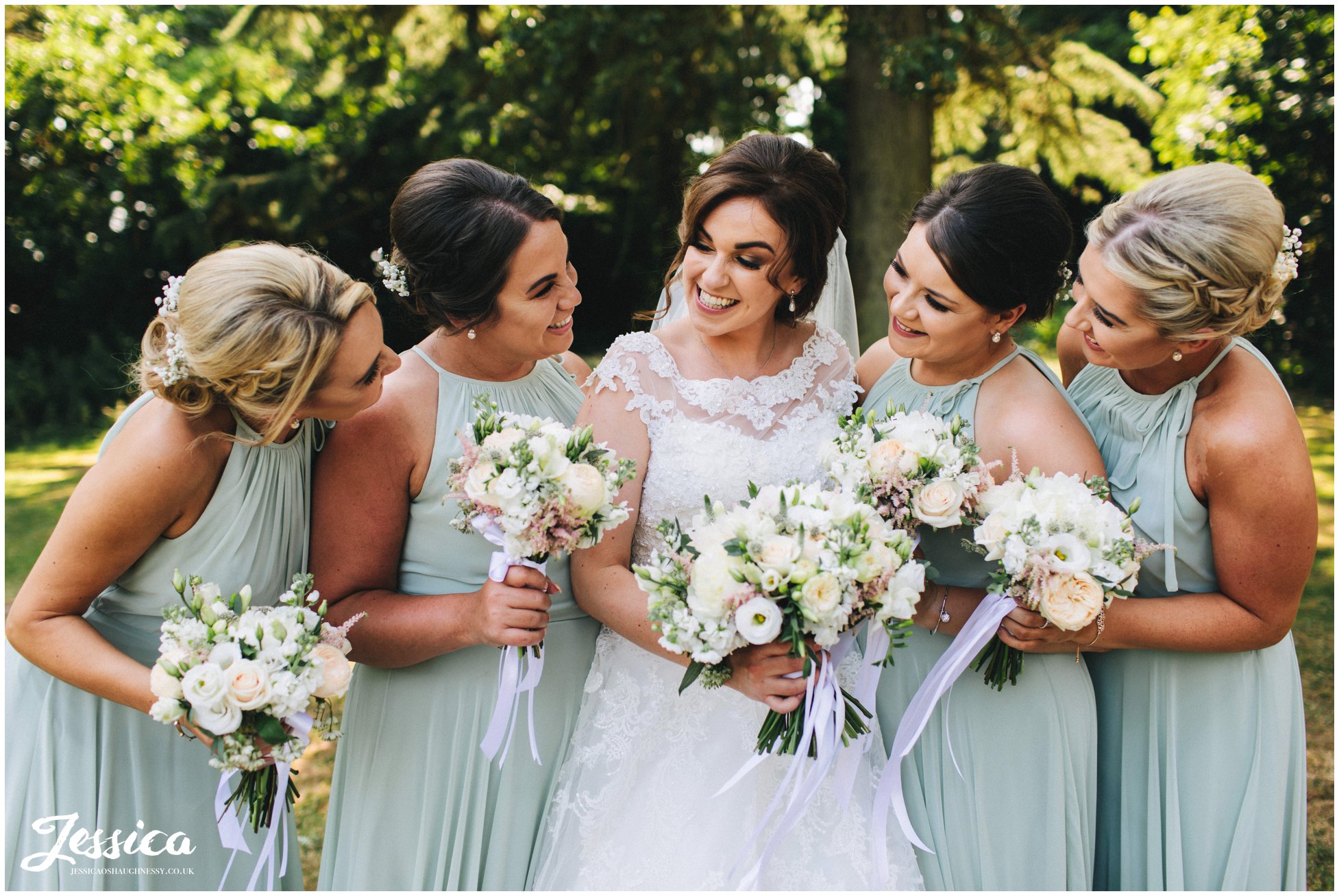 bride & her bridesmaids laughing together