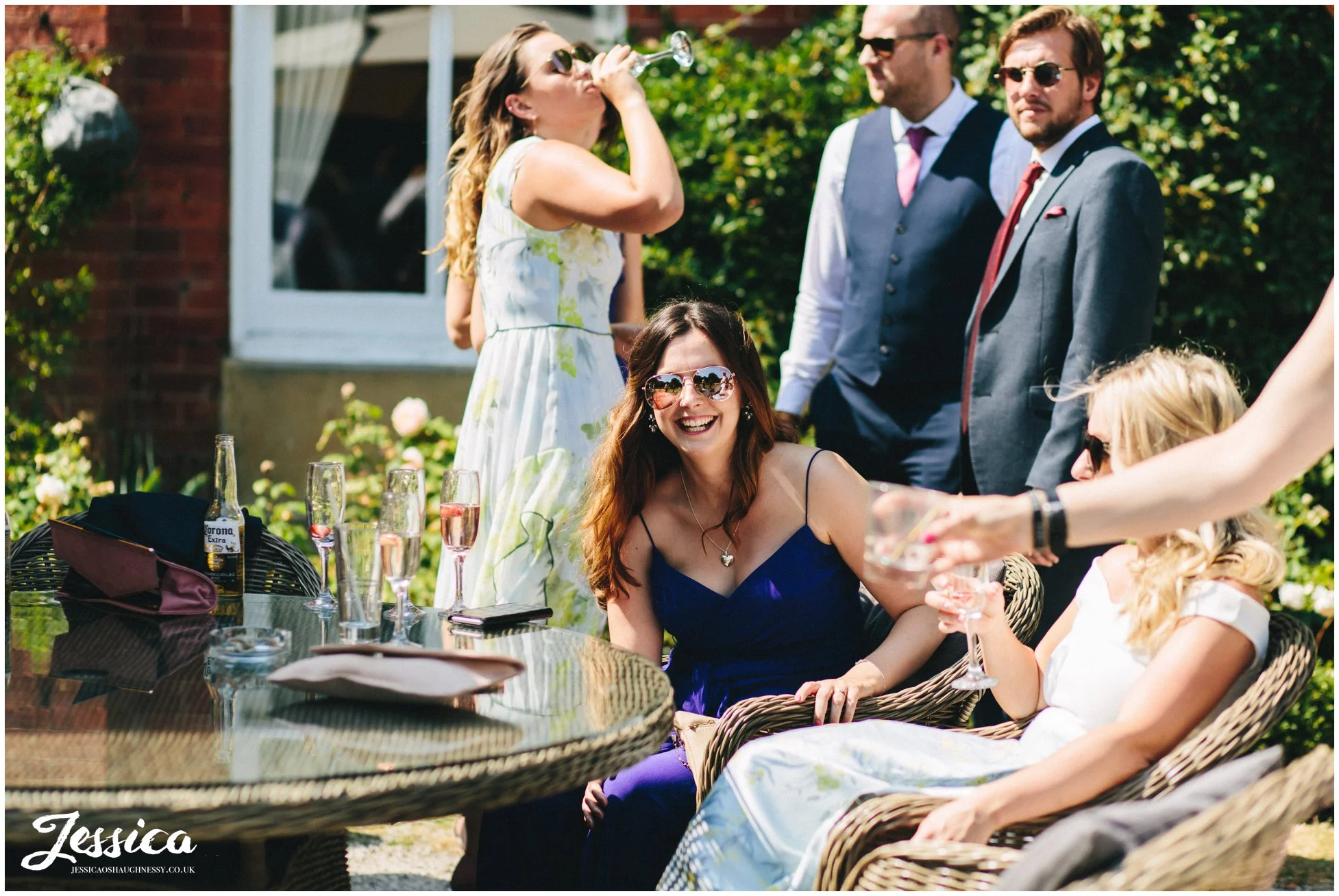 guest laughs sat on bartle hall's terrace