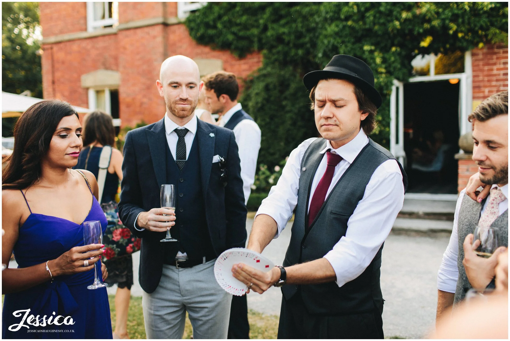 magician preforms tricks to entertain the guests