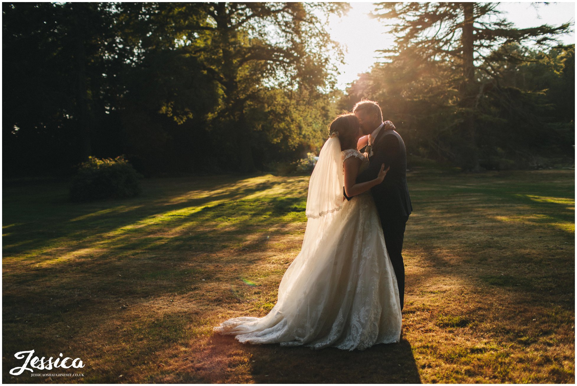 couple kiss in the golden light at the north west venue