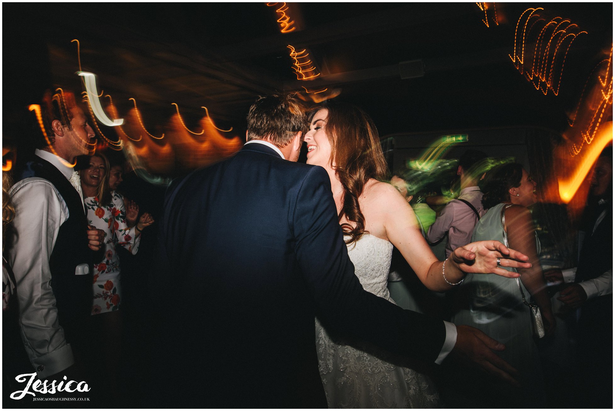 newly wed's dance on the dancefloor at their wedding reception