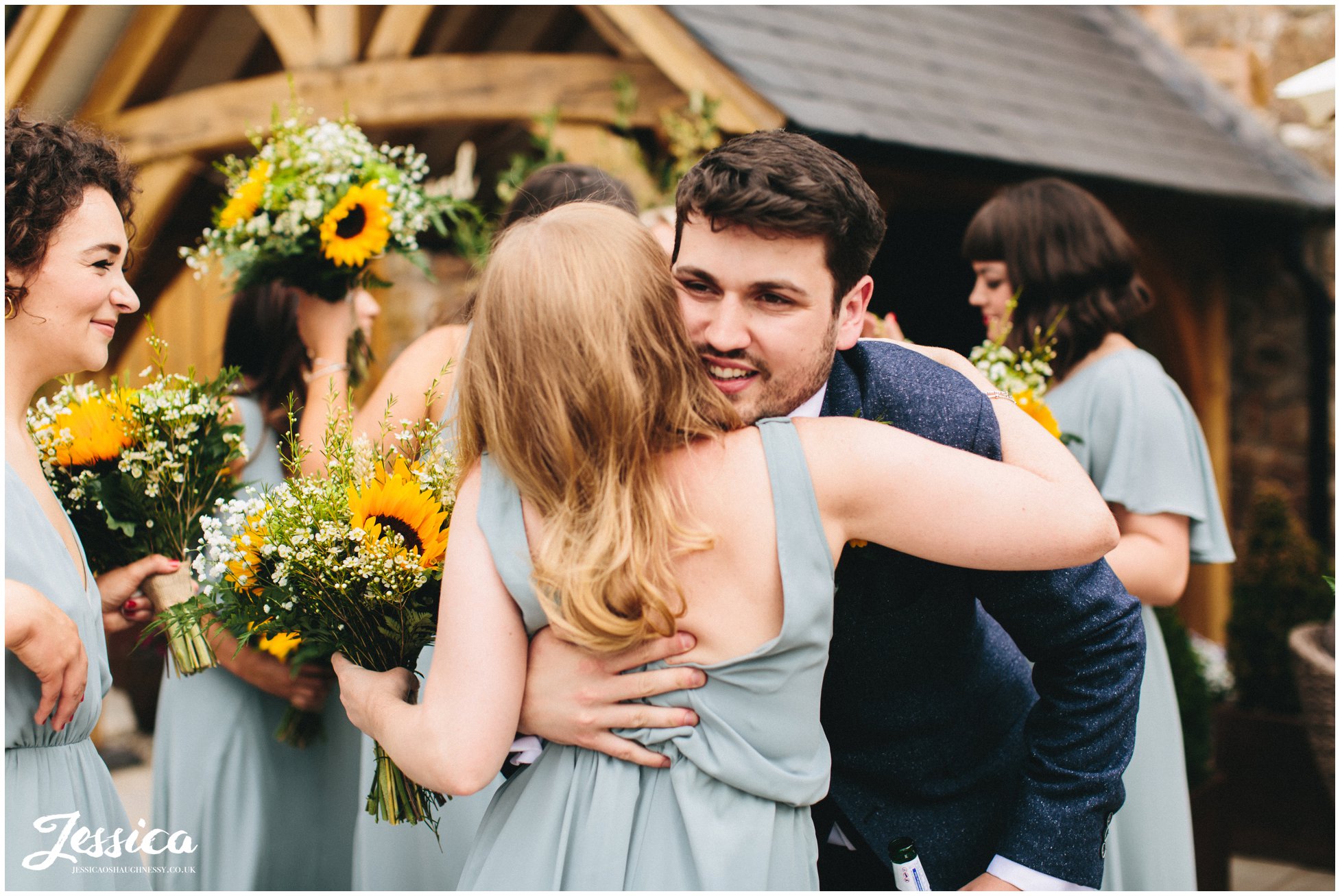 the bridesmaids congratulate the groom