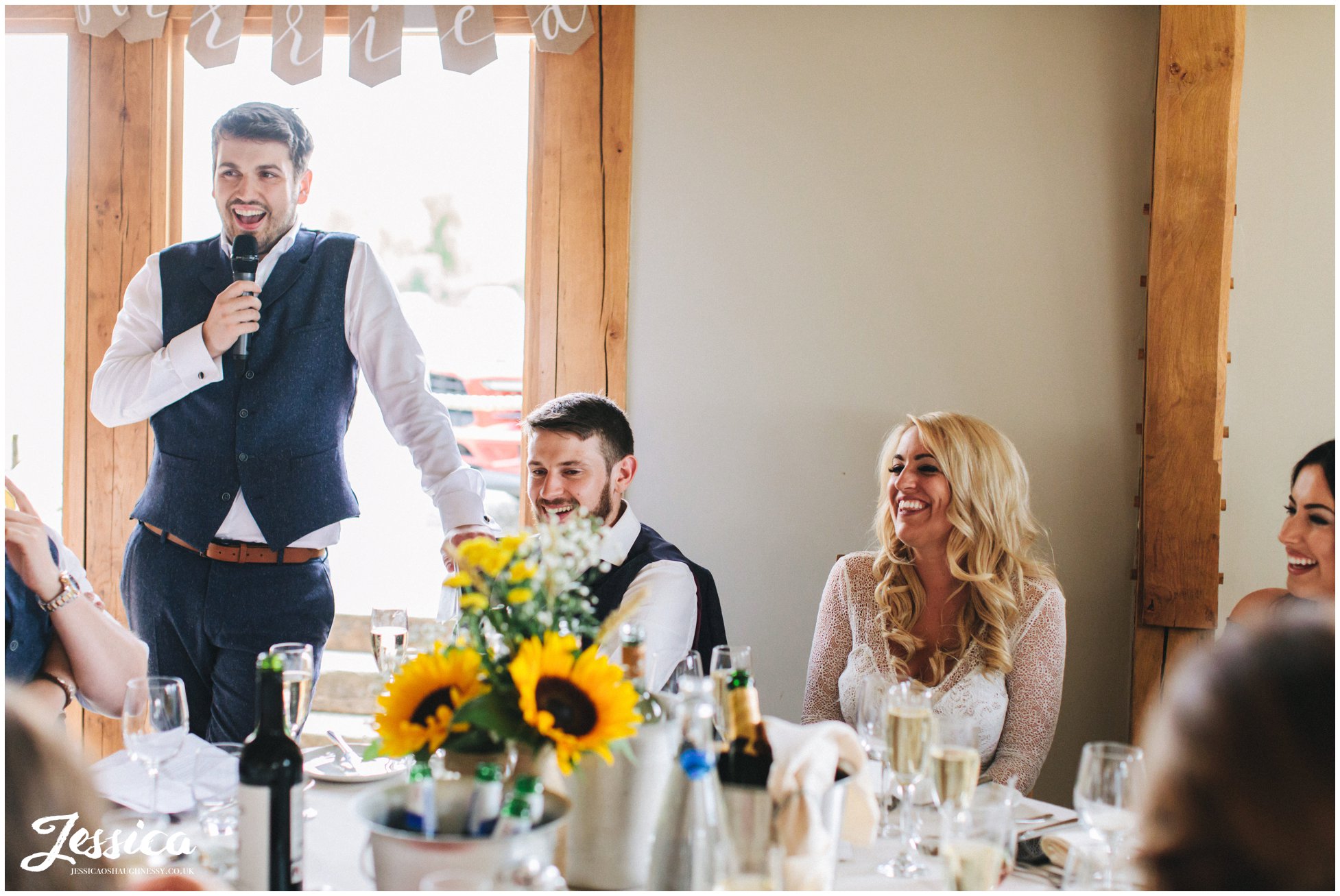 groom stands to give his speech at the north wales wedding venue