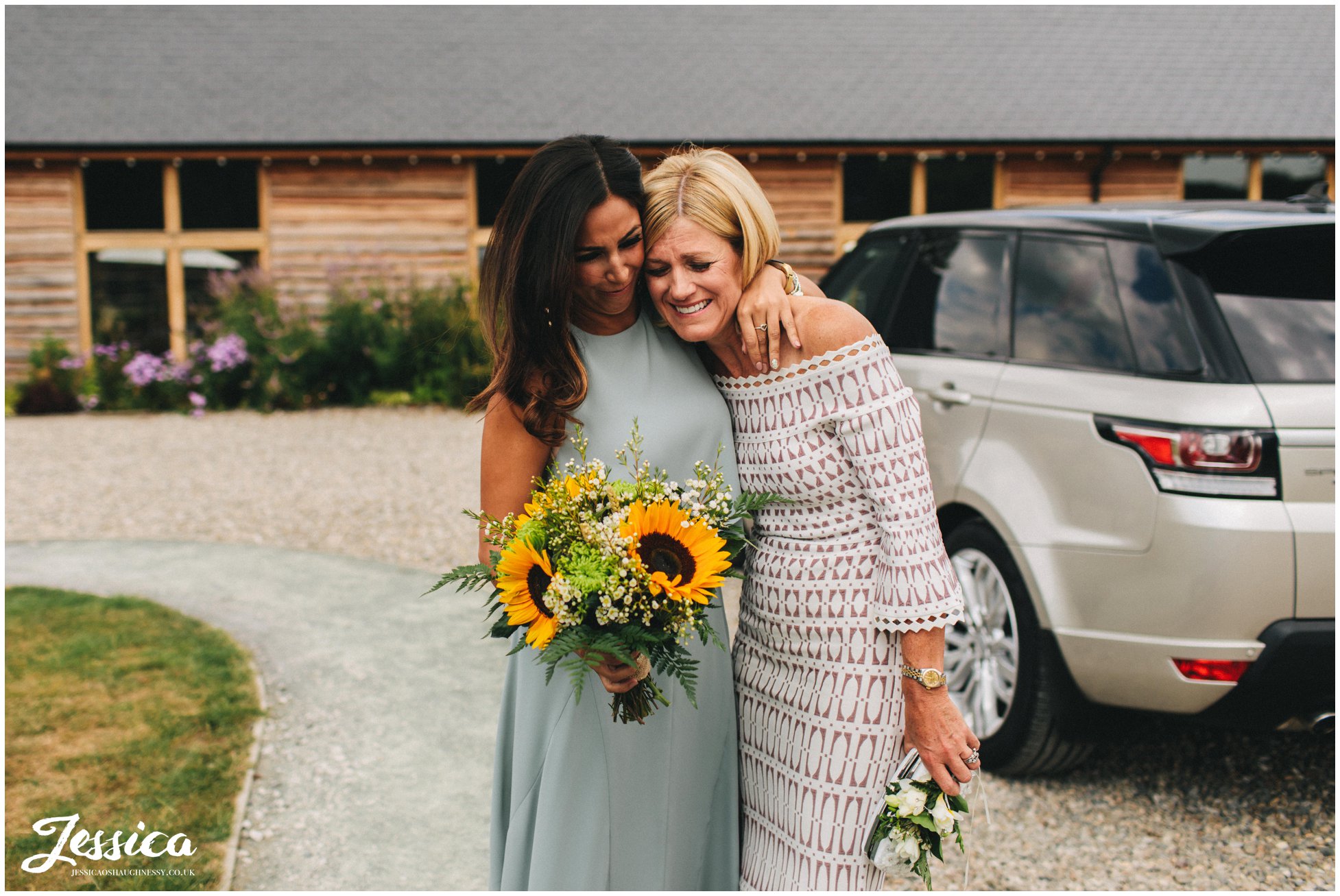 mother of the bride gets emotional before the ceremony