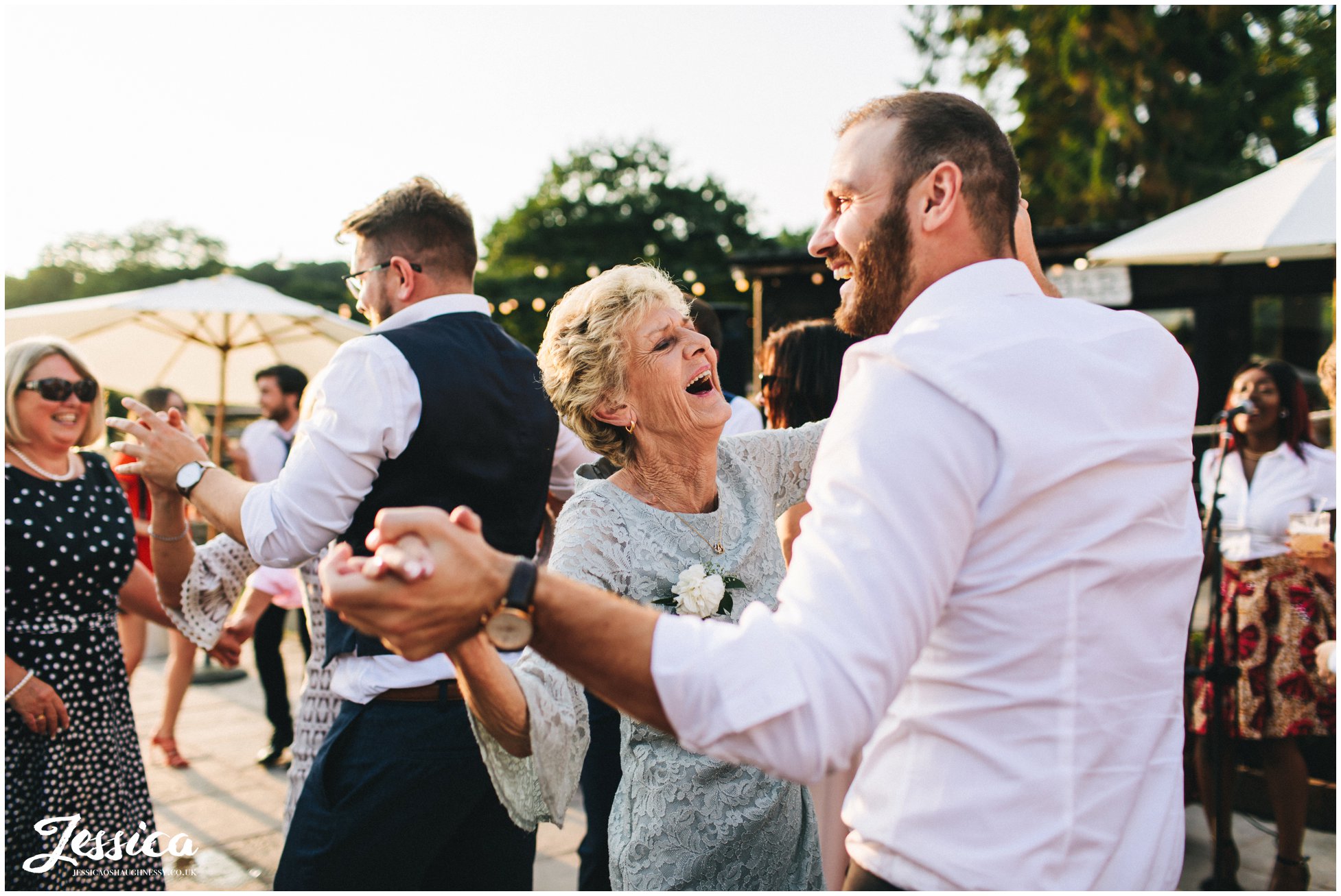 grandmother dances to the singers