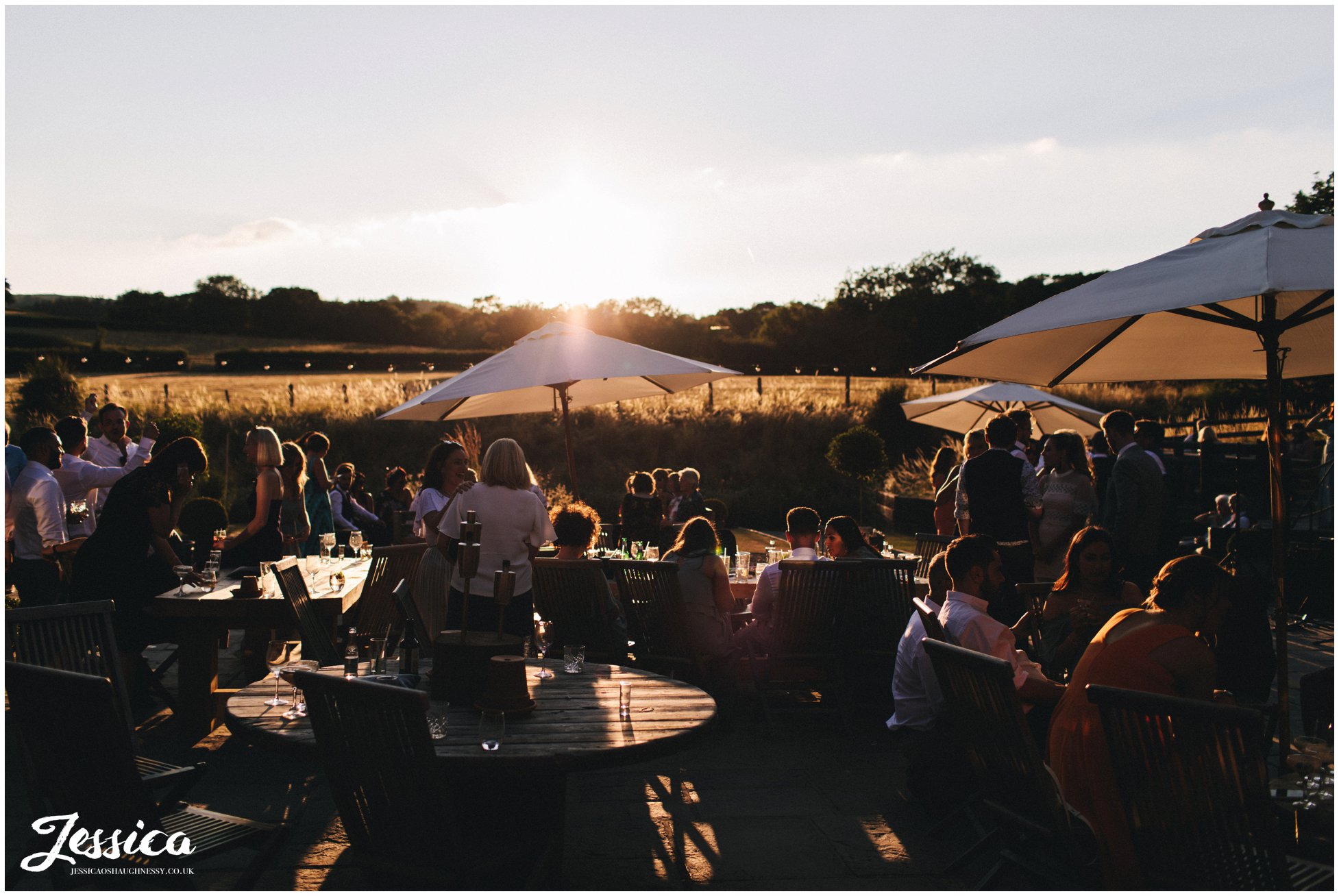 guests enjoy the last bit of sun at tower hill barns