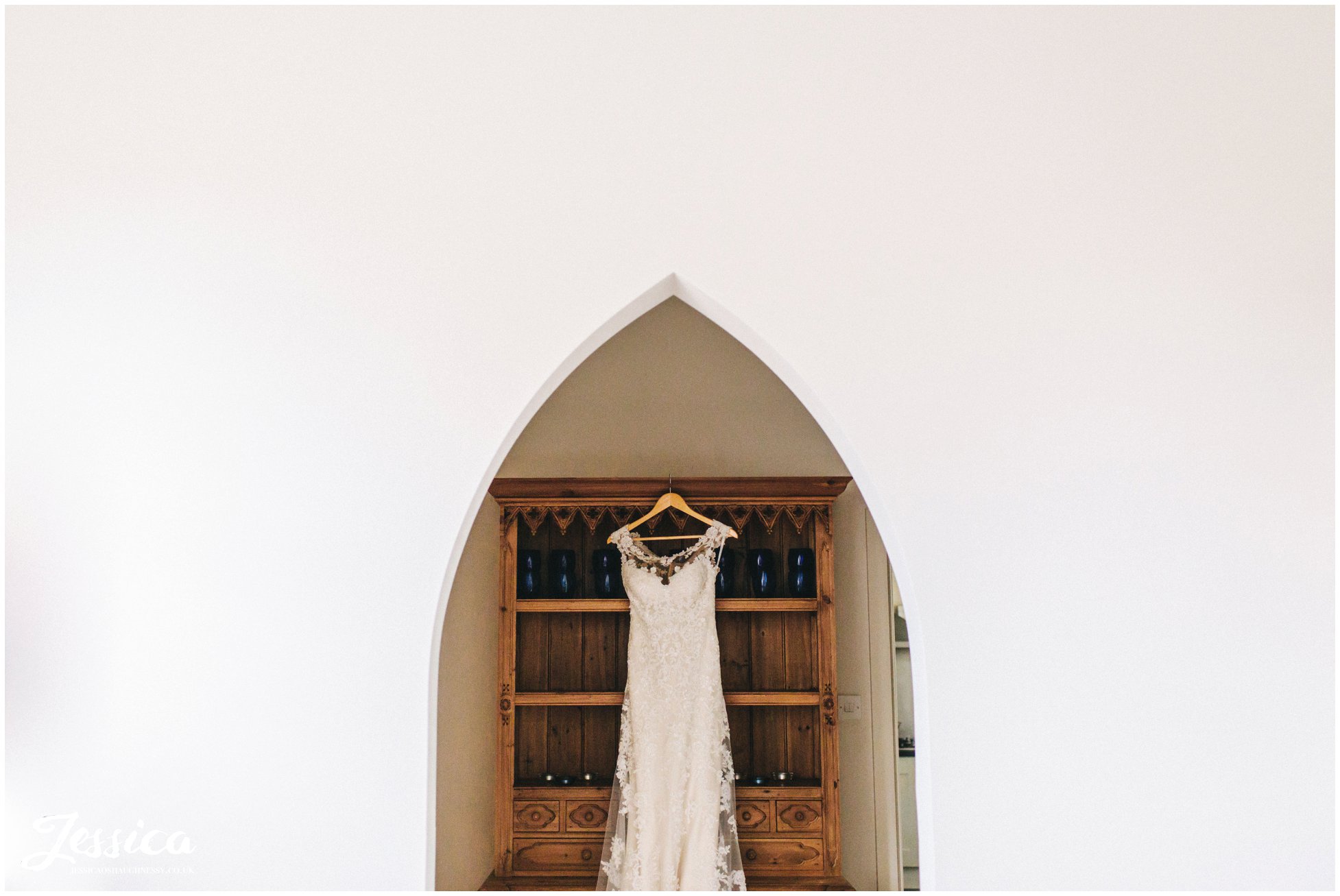 wedding dress hanging ready for the bride