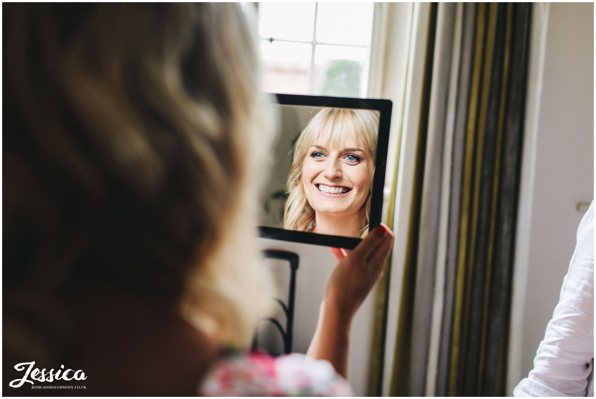 bride see's her wedding makeup for the first time