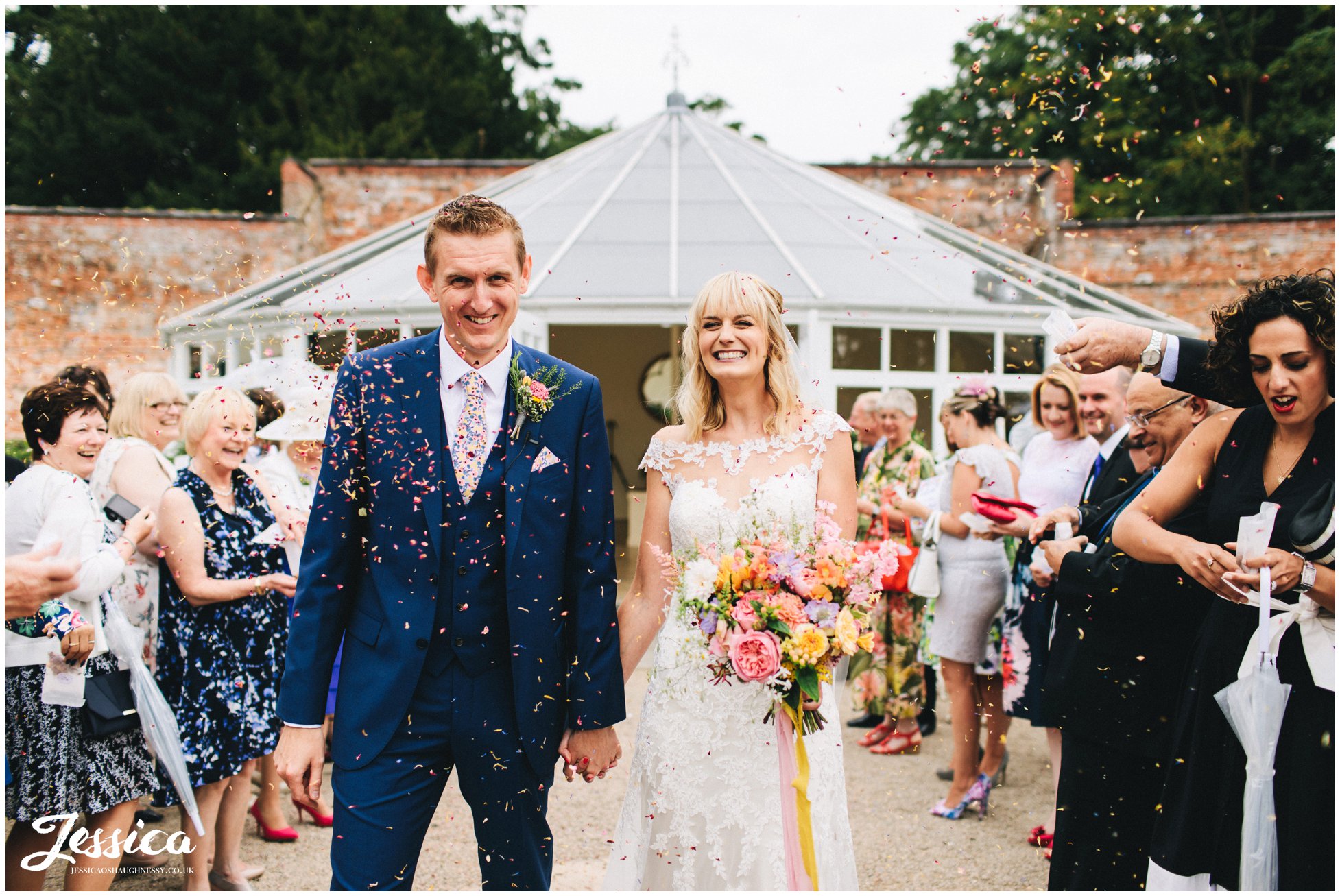 newly wed's are showered in confetti 