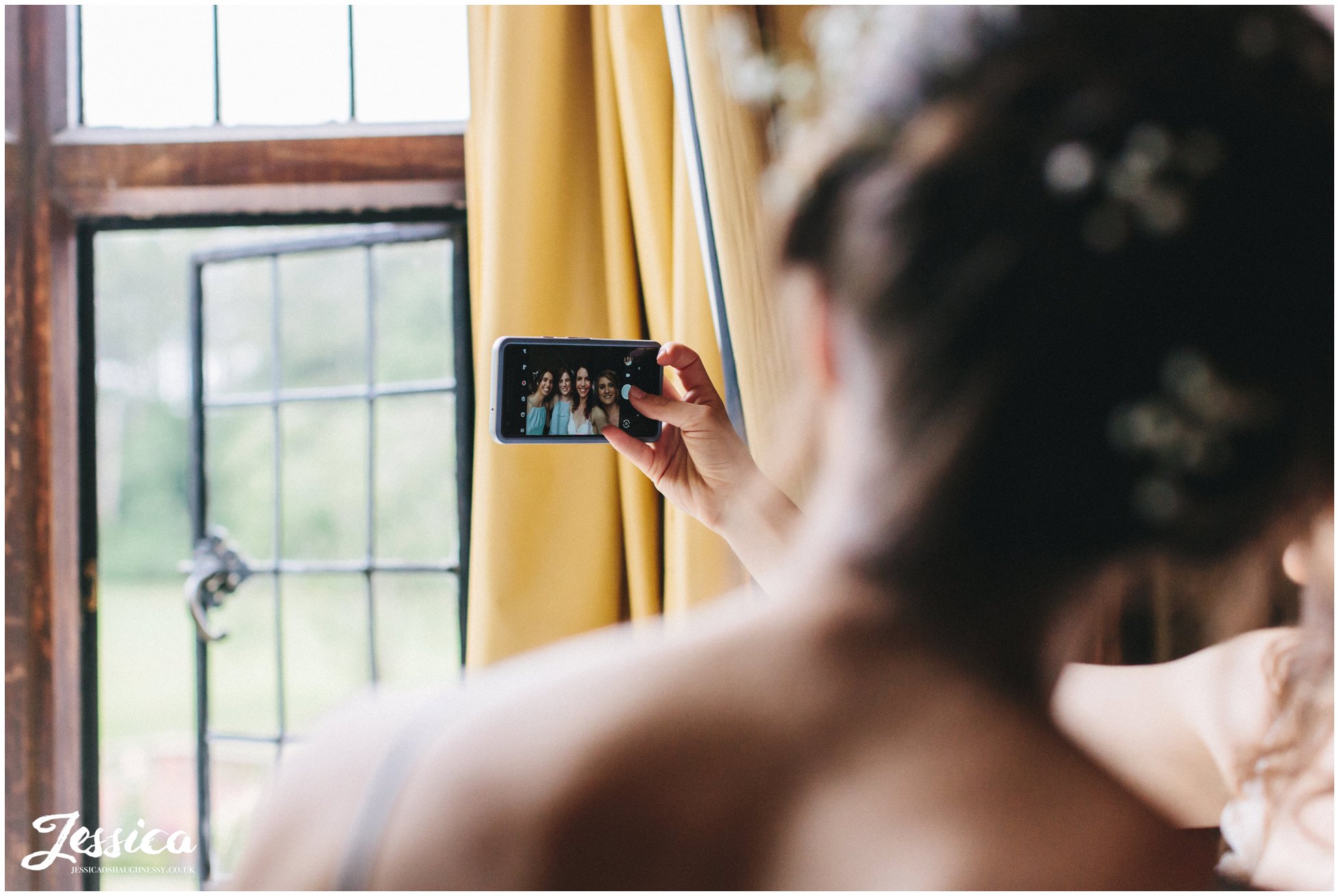 the bridal party take a selfie before the ceremony