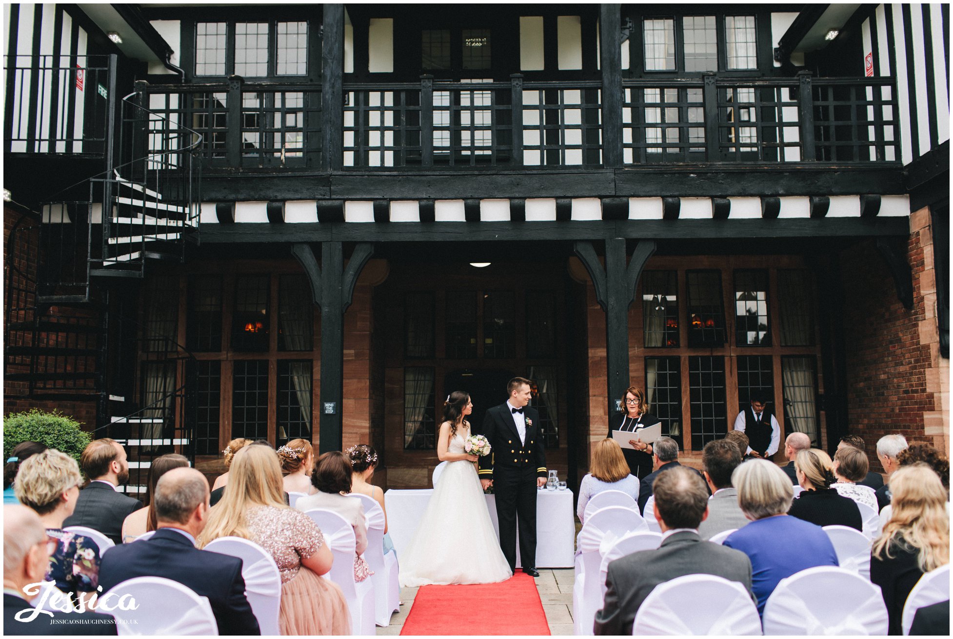 the couple have an outdoor ceremony on the terrace