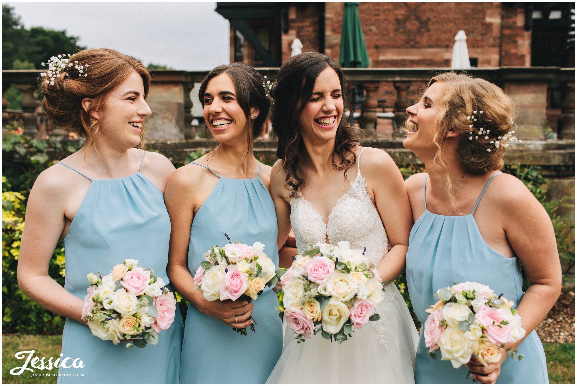 the bride laughs with her bridesmaids