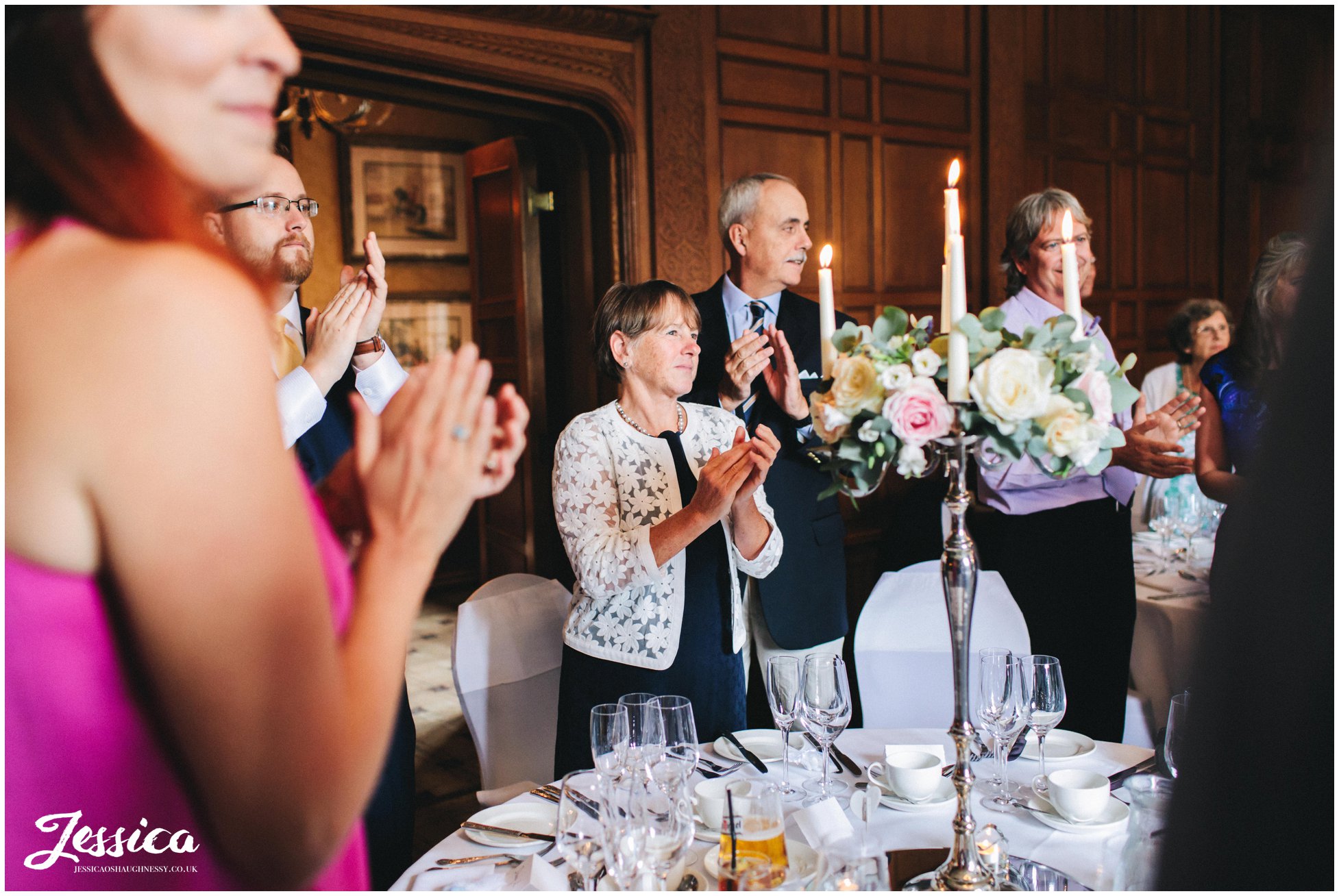 guests applaud the new couple