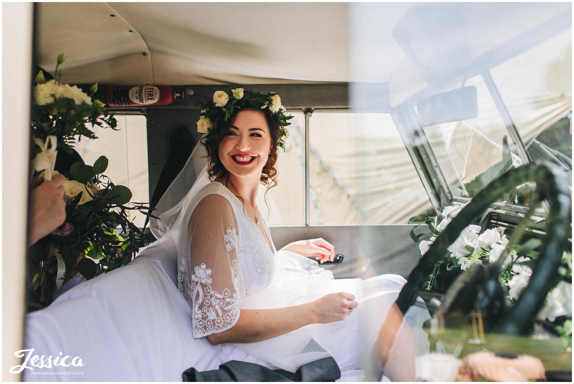 bride arrives in her fathers jeep