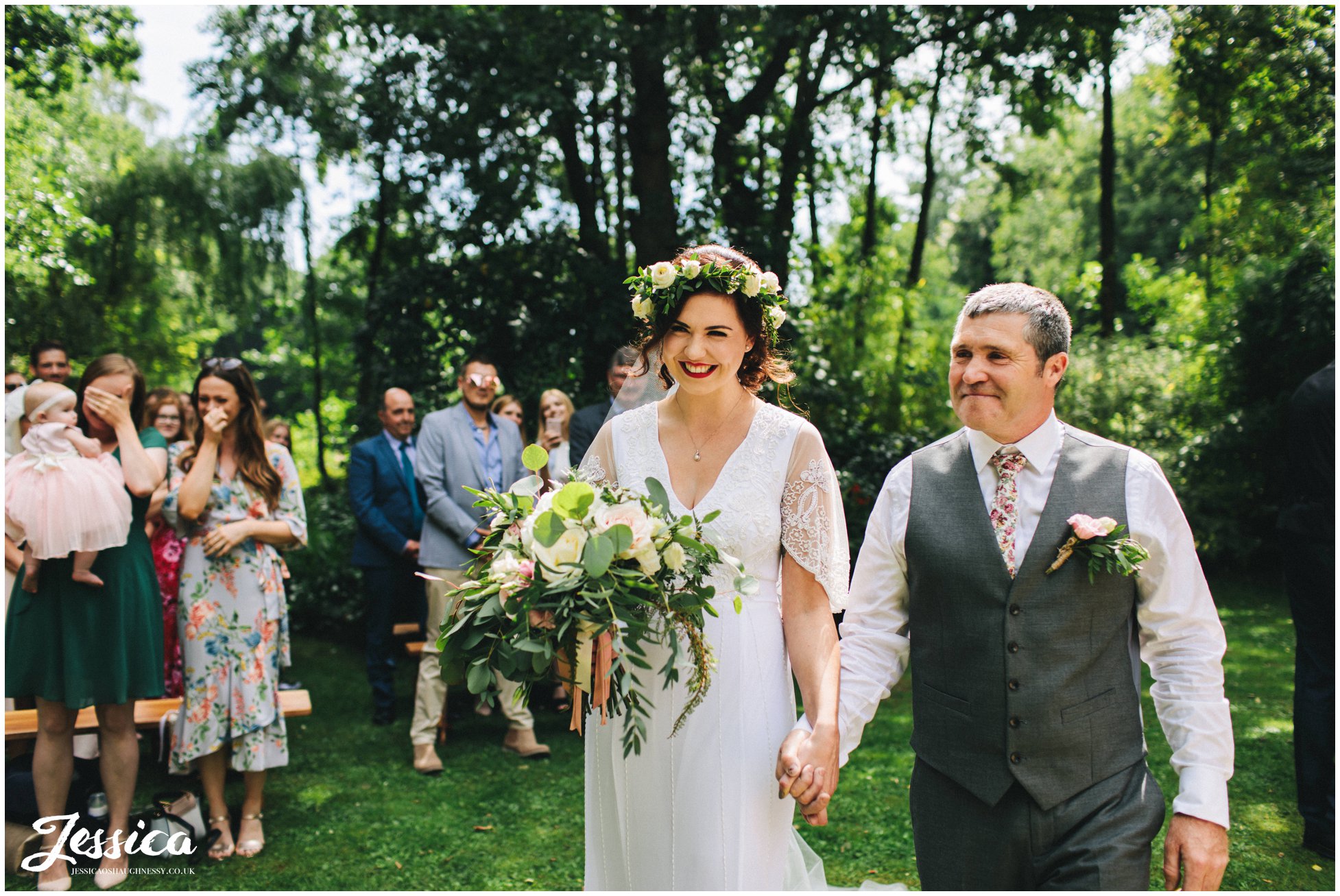 an outdoor ceremony at stonyford cottage gardens in the woodland