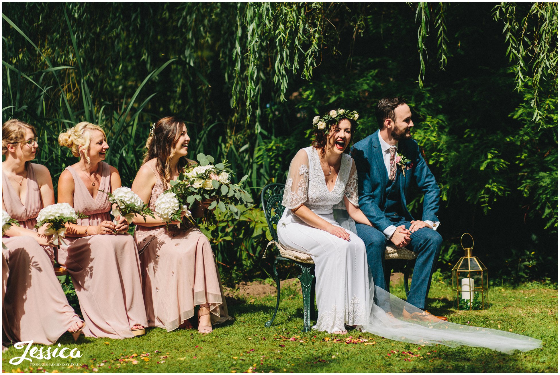 the couple laugh whilst seated during the service