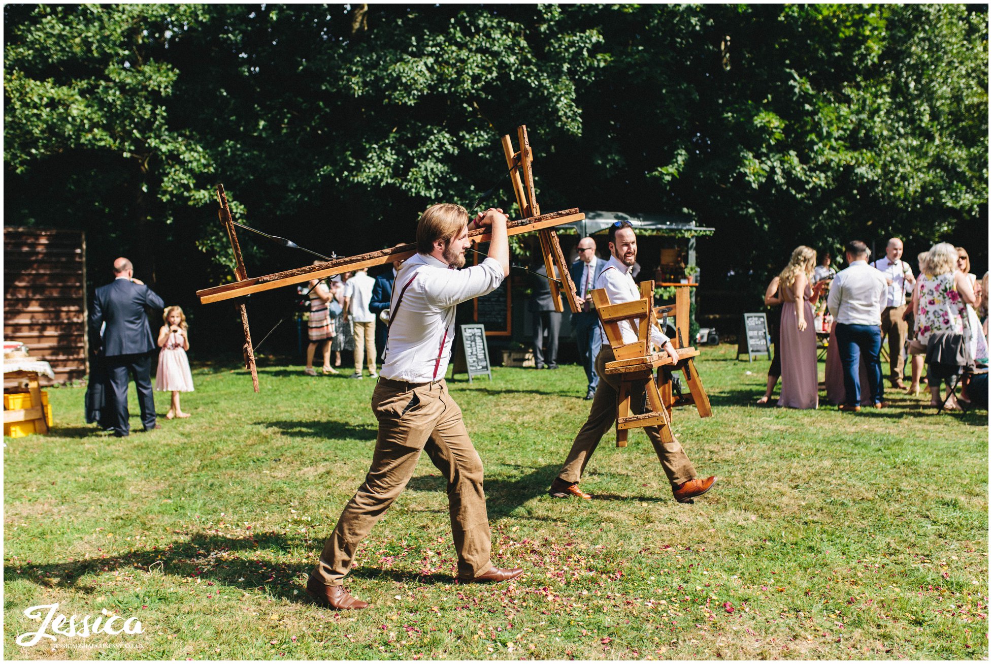 groomsmen carry benches into the tipi