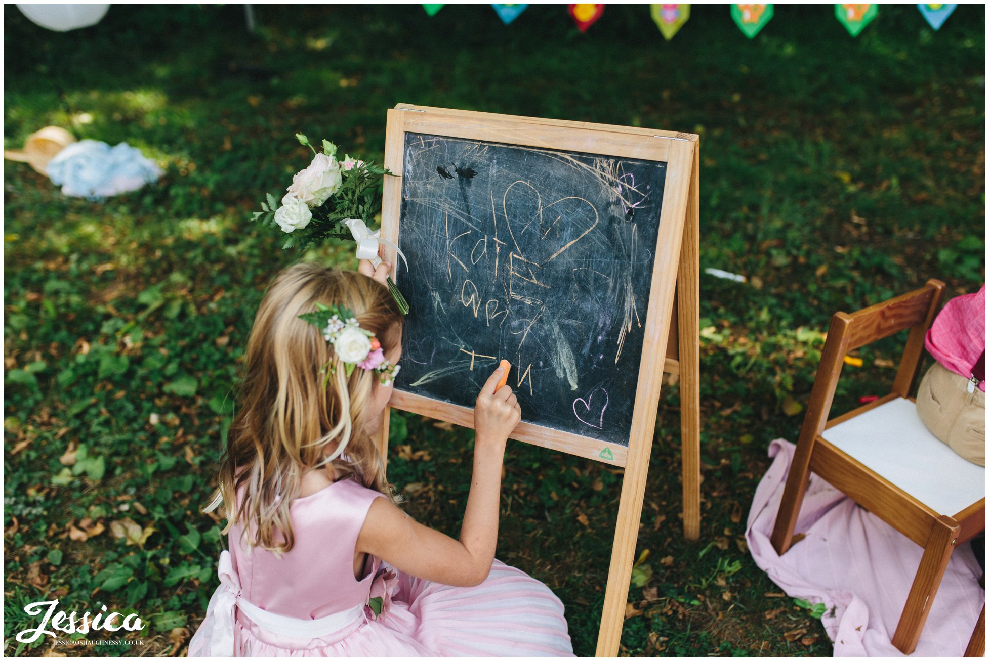 flower writes the couples name on the blackboard