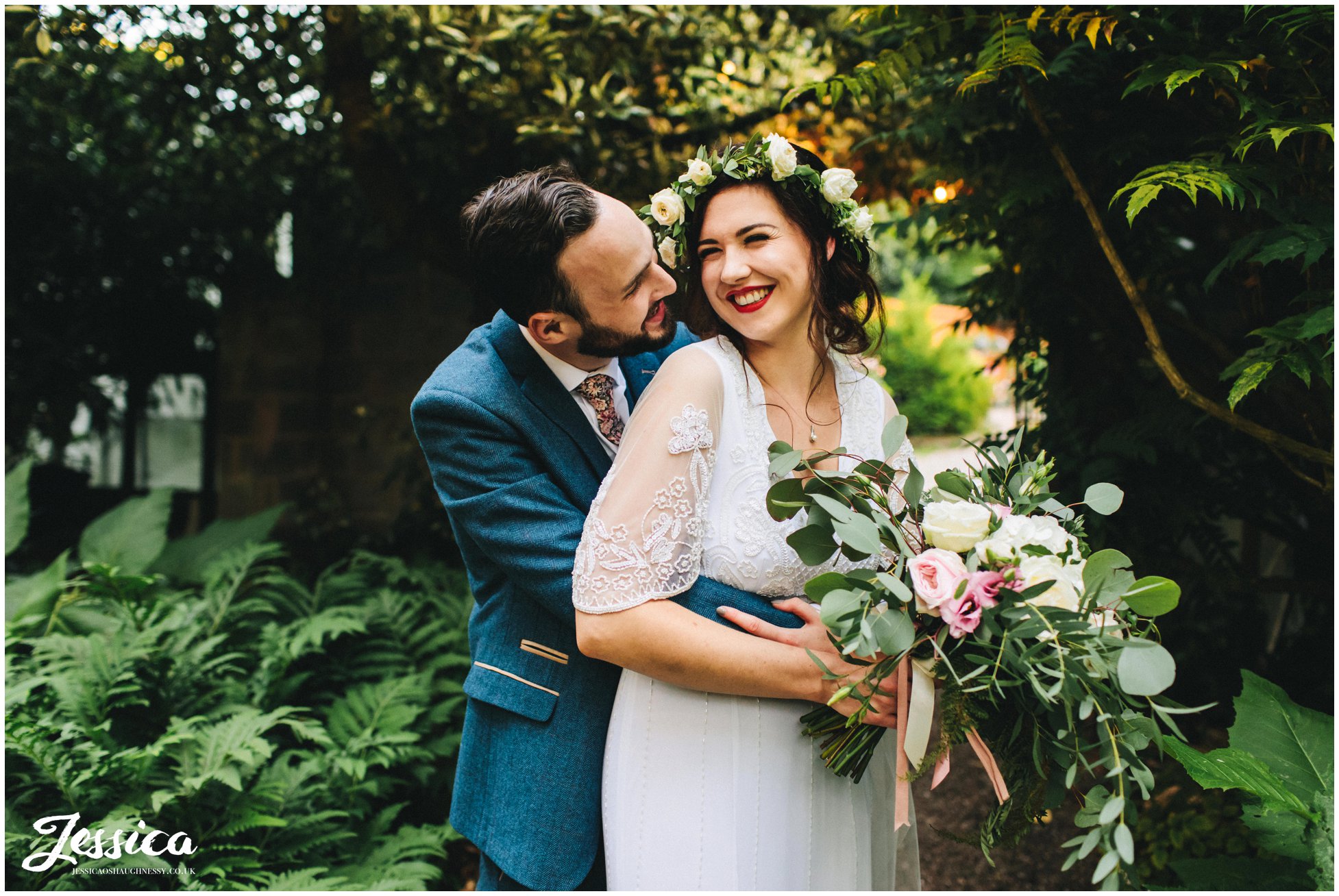 couple embrace in stonyford cottage gardens