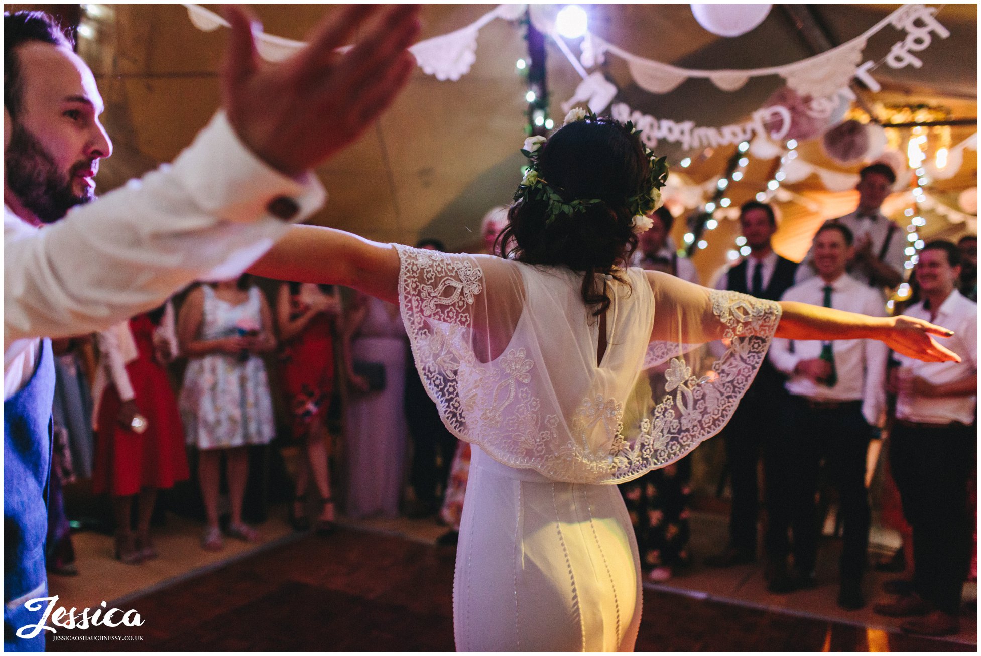 bride shows of boho beaded wedding dress