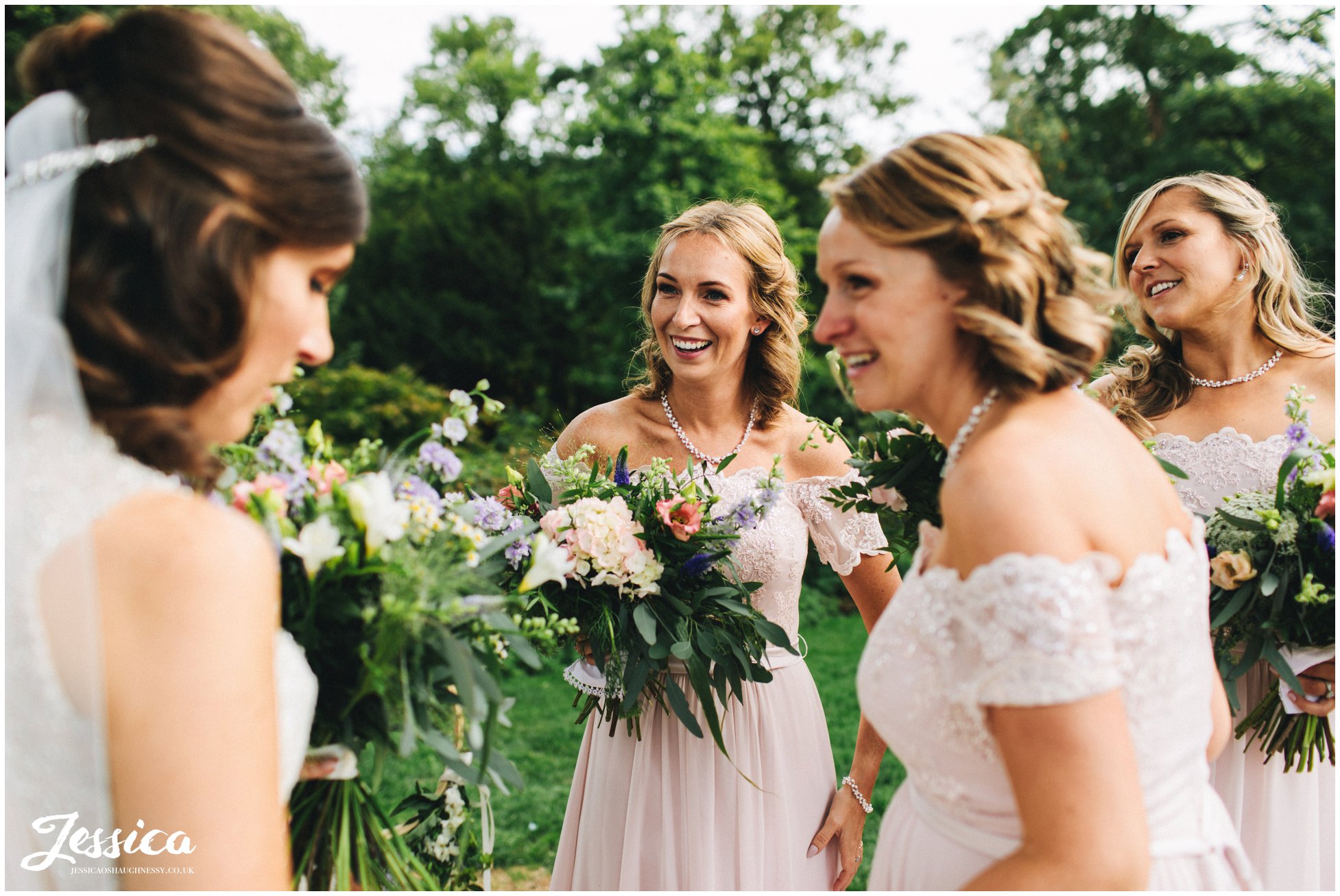 bridesmaids congratulate the new bride