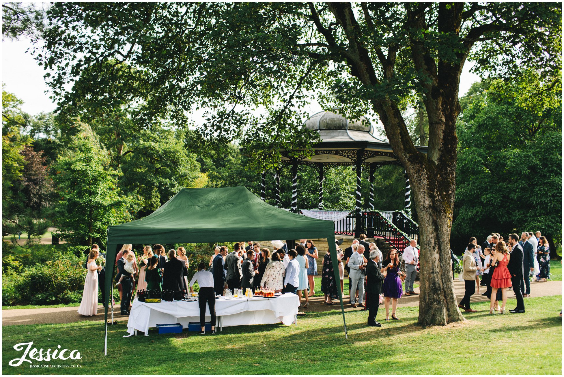 guests enjoy reception drinks in buxton pavilion gardens