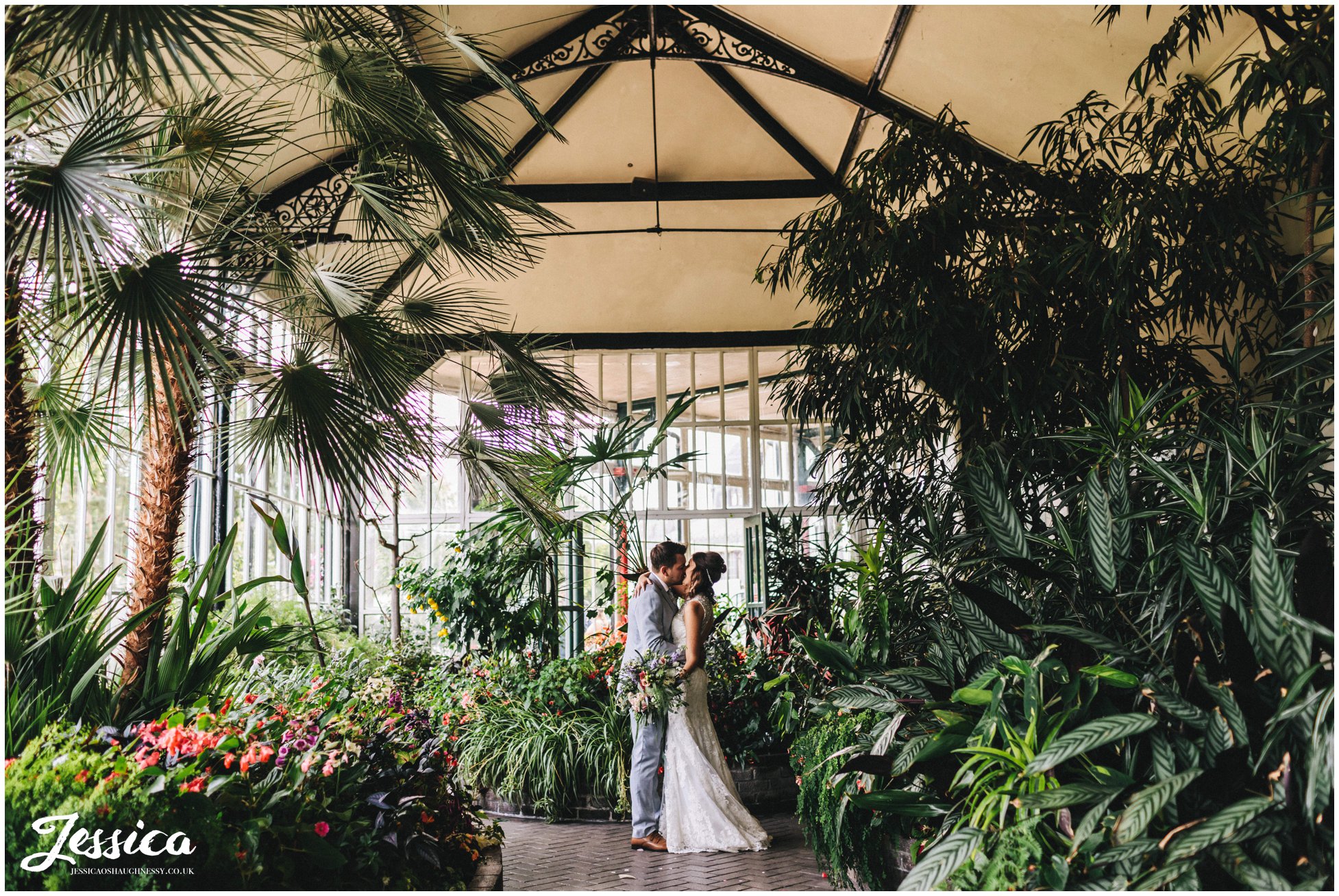 newly wed's kiss in the greenhouse at buxton pavilion gardens