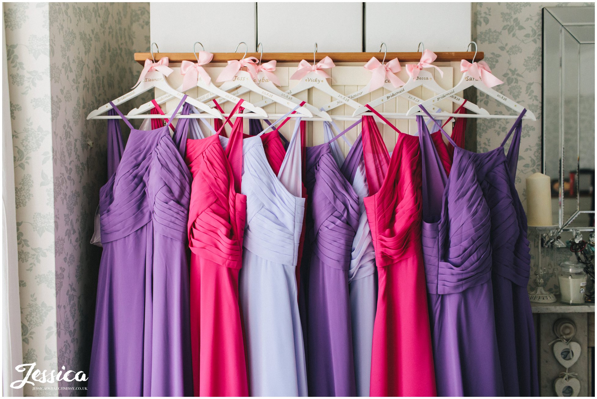 bridesmaids dresses hung on the wardrobe 